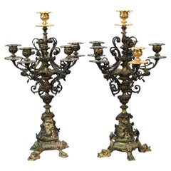 Antico candelabro figurato in bronzo e finitura dorata a sei candele a vento C1890