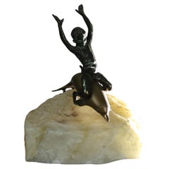 Antique Figural Bronze Sculpture of a Boy Riding a Dolphin C1900