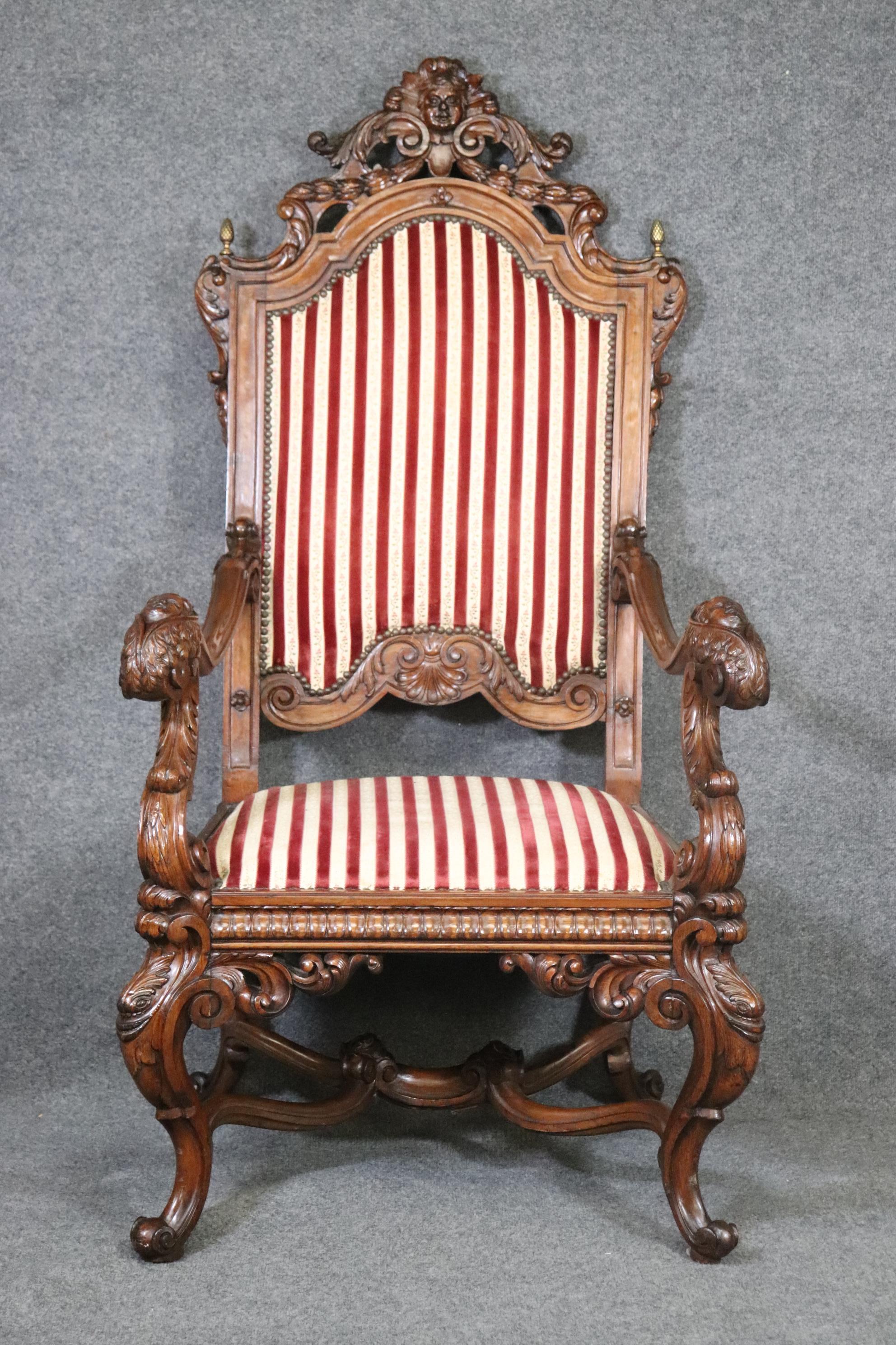 Dimensions- H: 58.25in W: 30.5in D: 31in SH: 19in
This antique carved throne chair is made of the highest quality and is extremely nice! If you take a close look you can see the detail in the faces on the top of the arms as well as the carved face