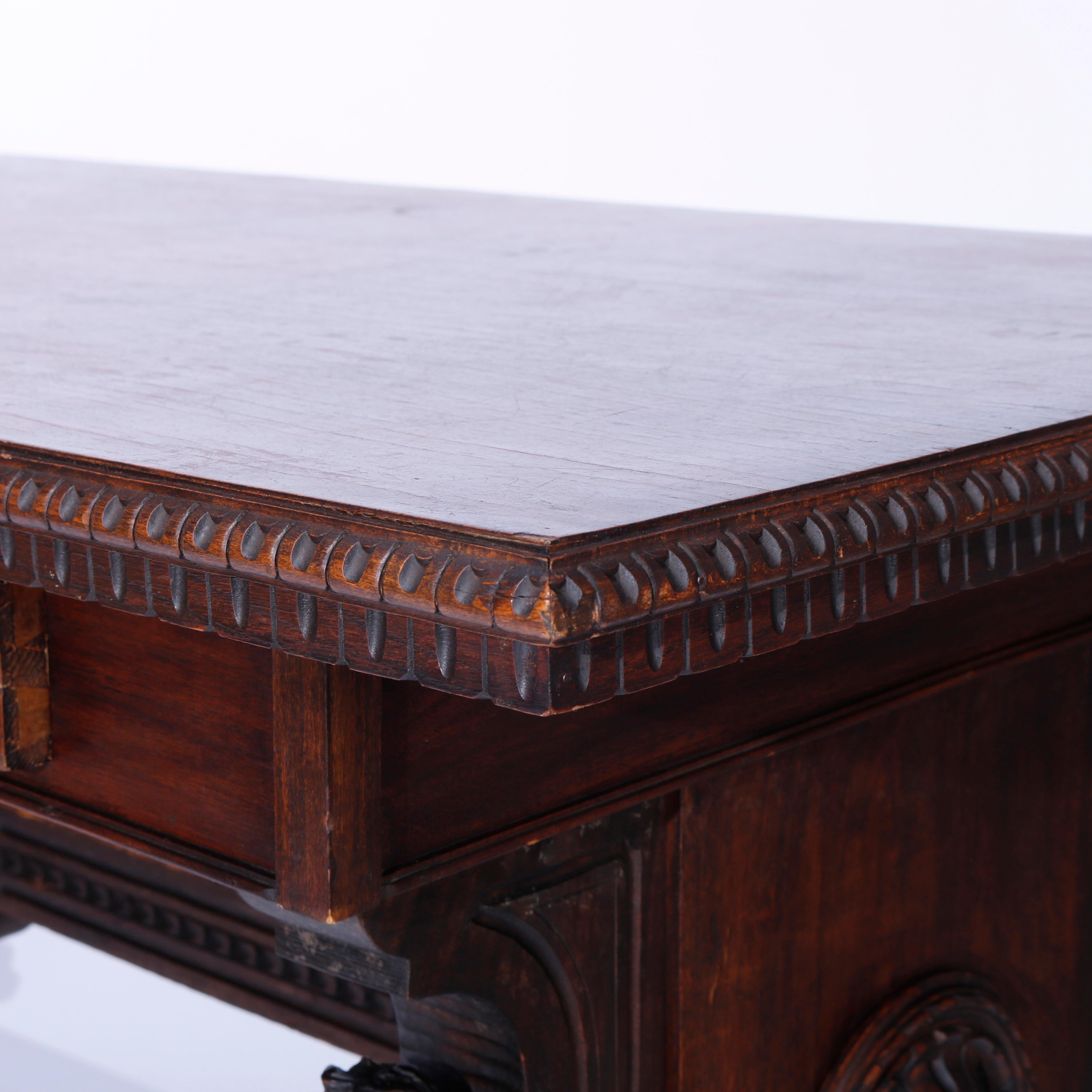 20th Century Antique Figural Carved Walnut Claw Foot Trestle Library Table, circa 1900