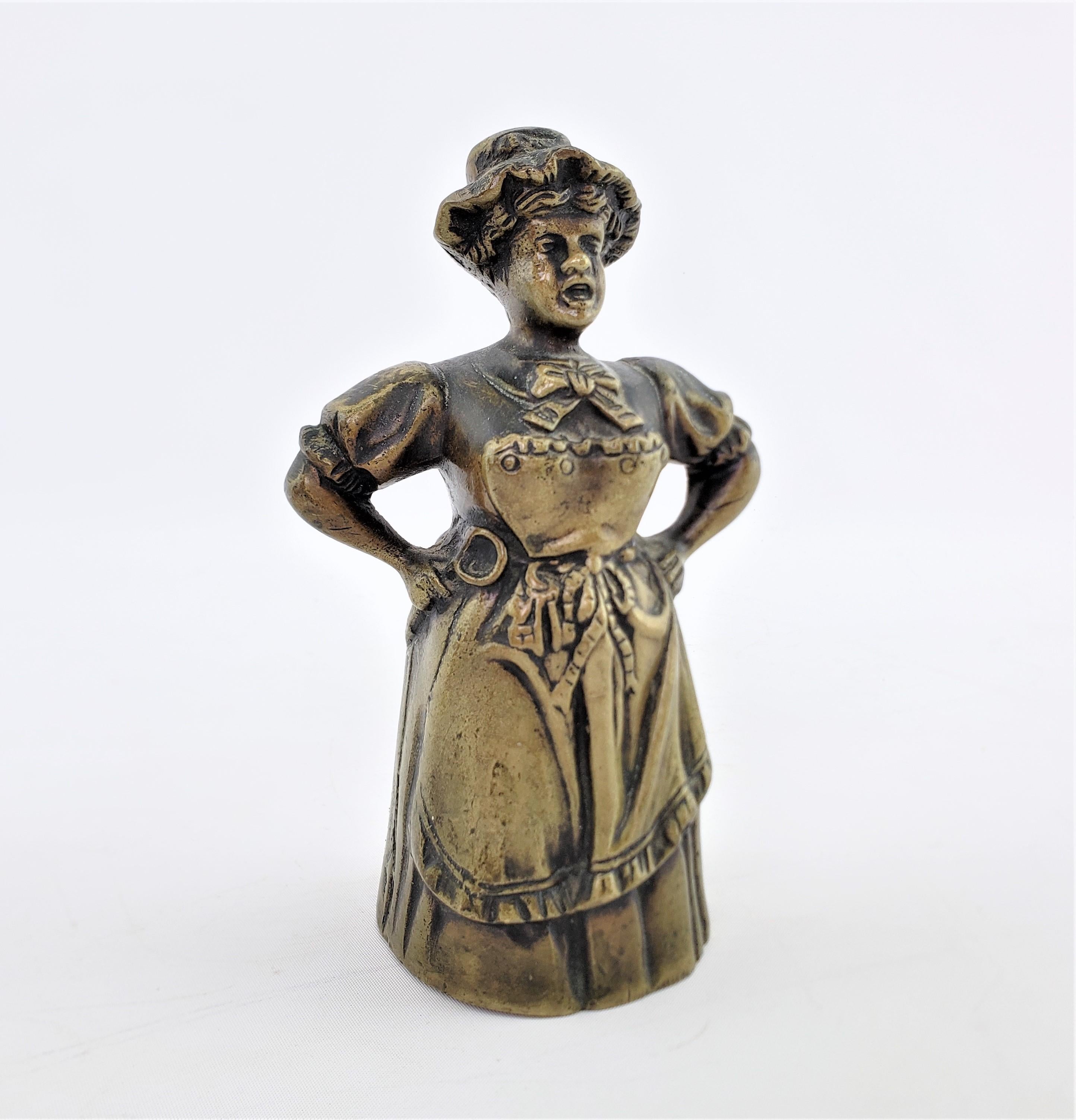 This antique whimsical cast bronze figural bell is unsigned and has no foundry mark, but is presumed to originate from the United States and date to approximately 1880 and done in the period Victorian style. This detailed cast bell depicts an upset
