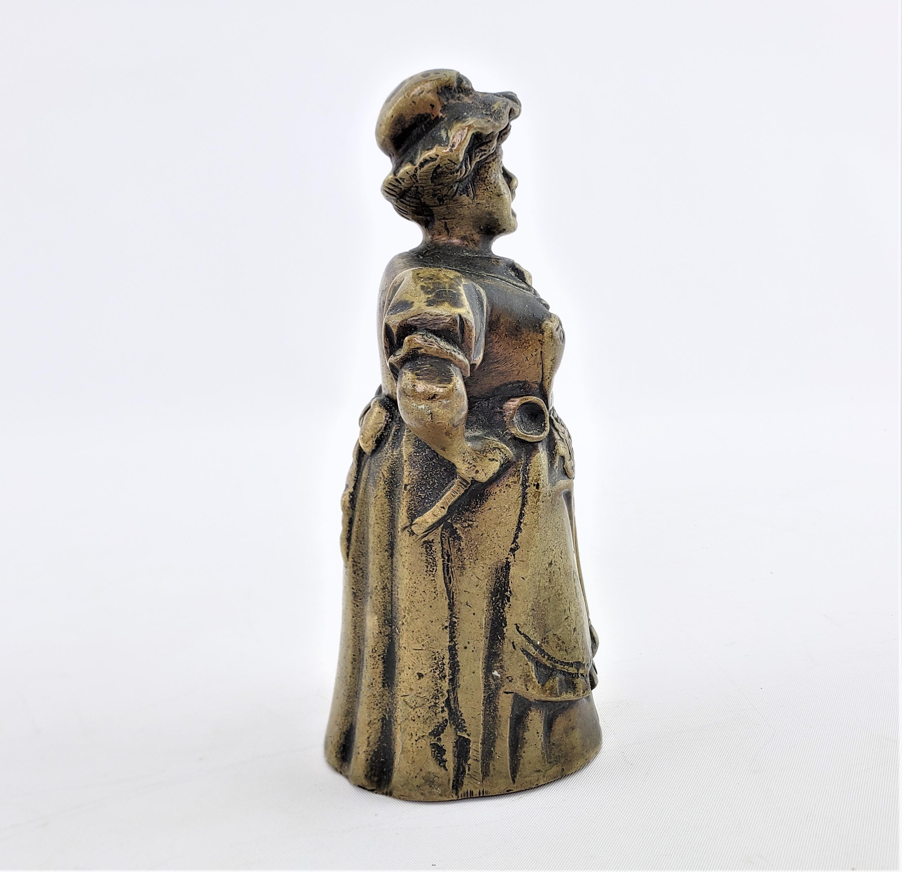 American Antique Figural Cast Bronze Dinner Bell with Upset Woman & Shoed Leg Clapper For Sale