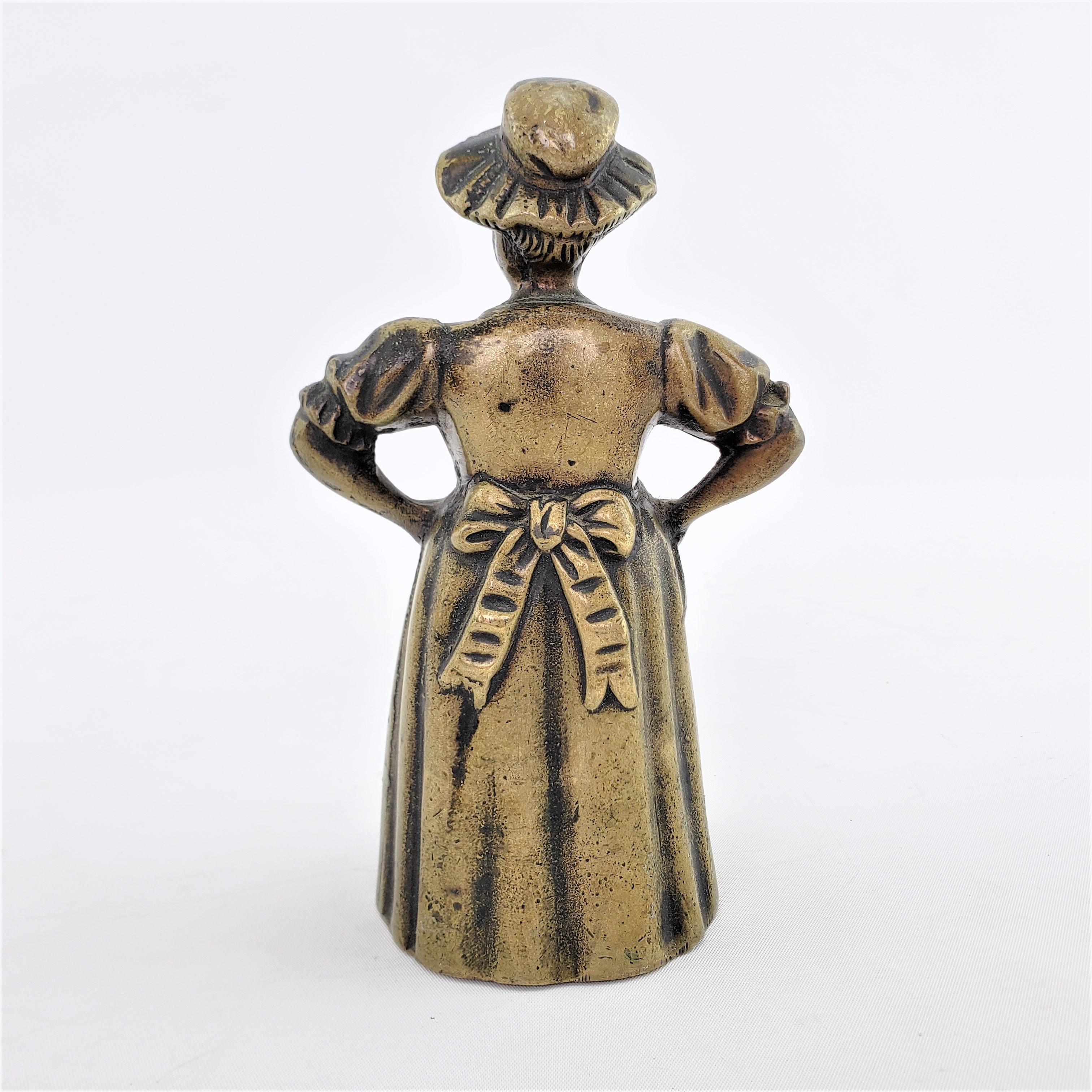 Antique Figural Cast Bronze Dinner Bell with Upset Woman & Shoed Leg Clapper In Good Condition For Sale In Hamilton, Ontario