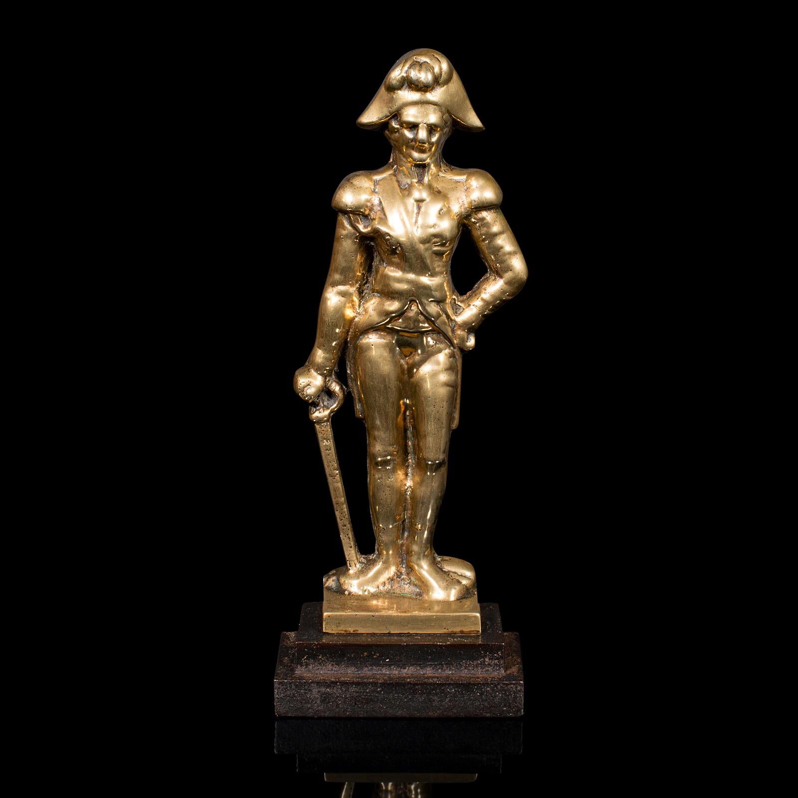 This is an antique figural doorstop. An English, brass and cast iron Lord Nelson door keeper, dating to the late Georgian period, circa 1810.

Wonderfully antique figure, with superb weight and great colour
Displays a desirable aged patina and in