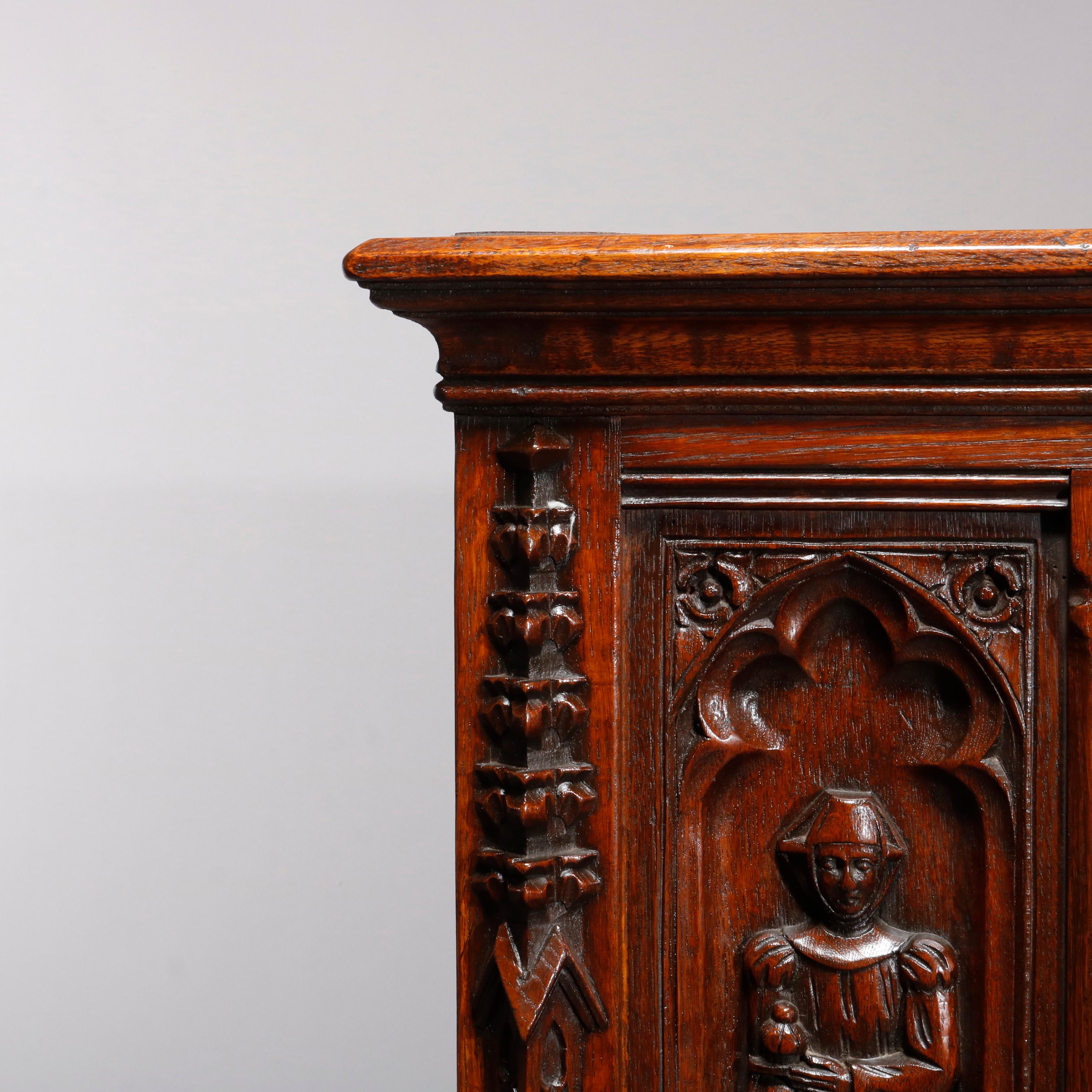 20th Century Antique Figural English Gothic Revival Carved Oak Court Cupboard, circa 1890