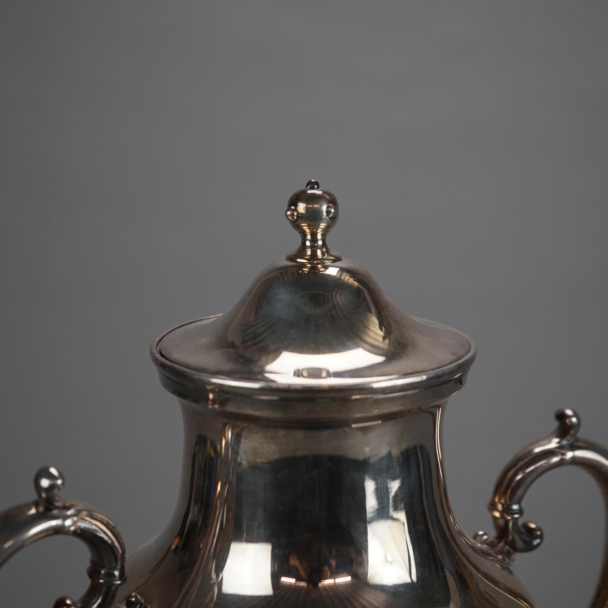 Samovar/théière antique en argent plaqué avec gravure de feuillage C1890

Mesures - 15,75 