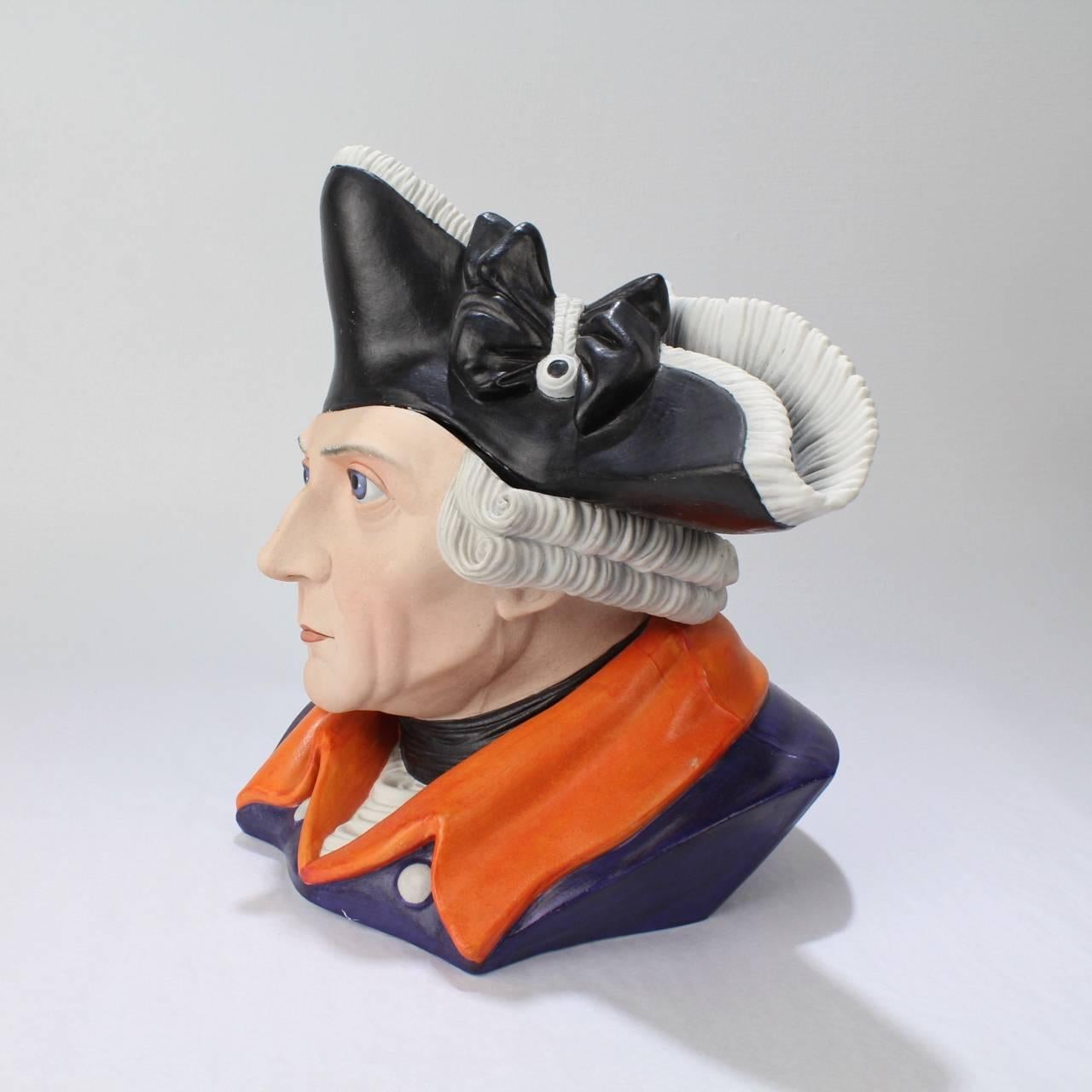 A rare, figural painted bisque humidor or dresser jar depicting the Prussian King - Frederick the Great (or Friedrich der Grosse).

A full bust with shoulders comprises the base of the jar. A tricorn hat forms the lid.
The base has impressed