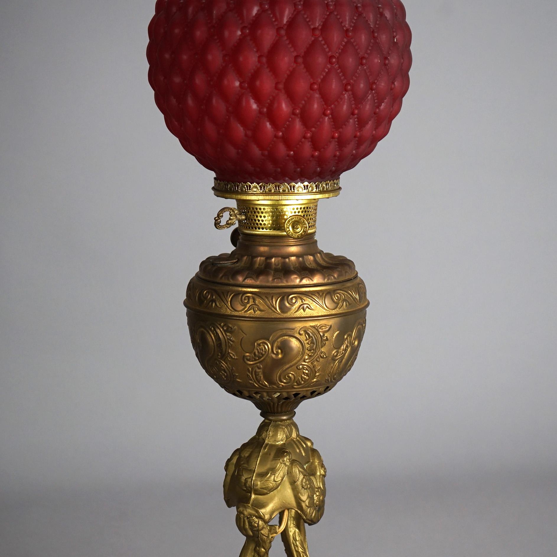 American Antique Figural Gilt Metal Parlor Lamp with Quilted Red Glass Shade Circa 1900 For Sale