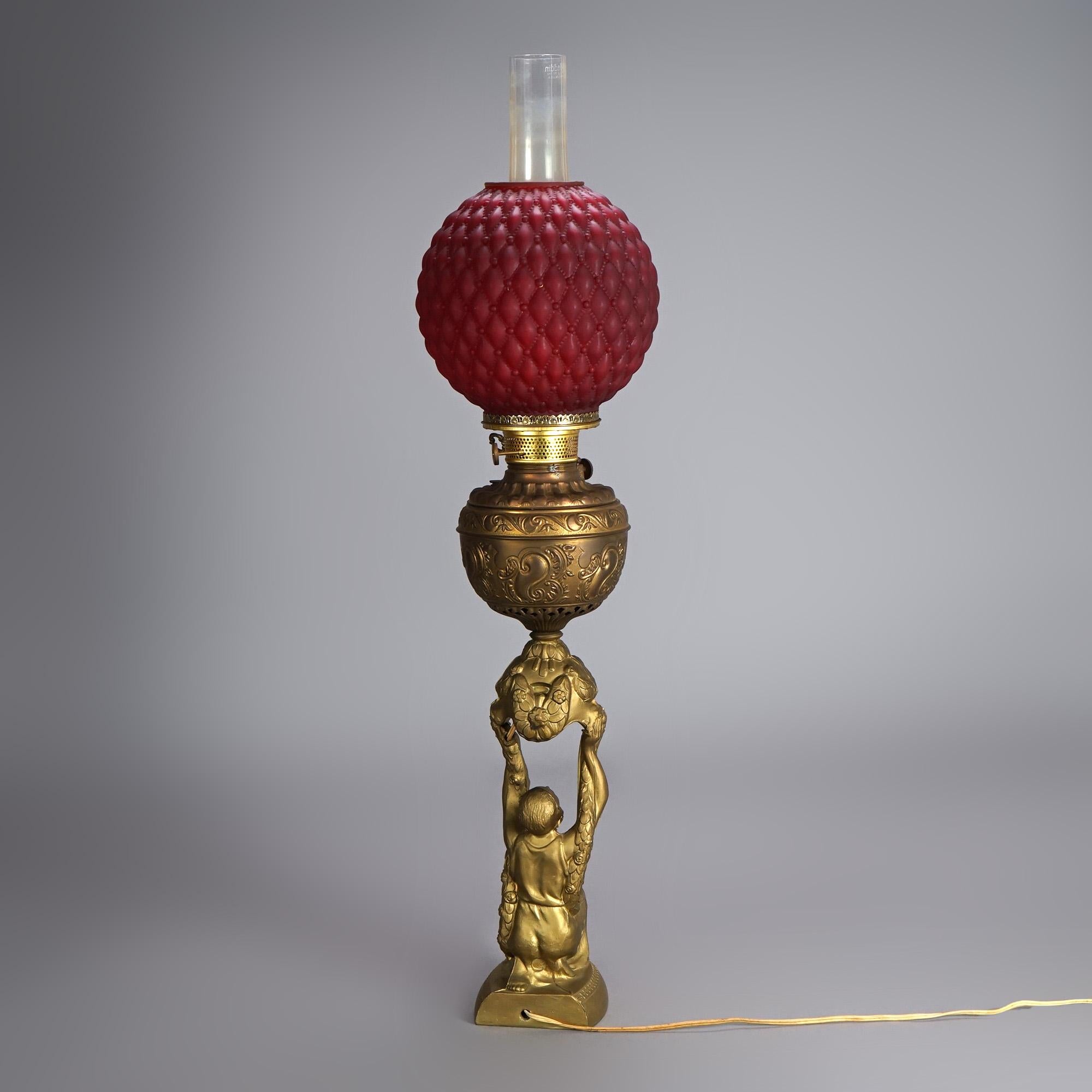 20th Century Antique Figural Gilt Metal Parlor Lamp with Quilted Red Glass Shade Circa 1900 For Sale