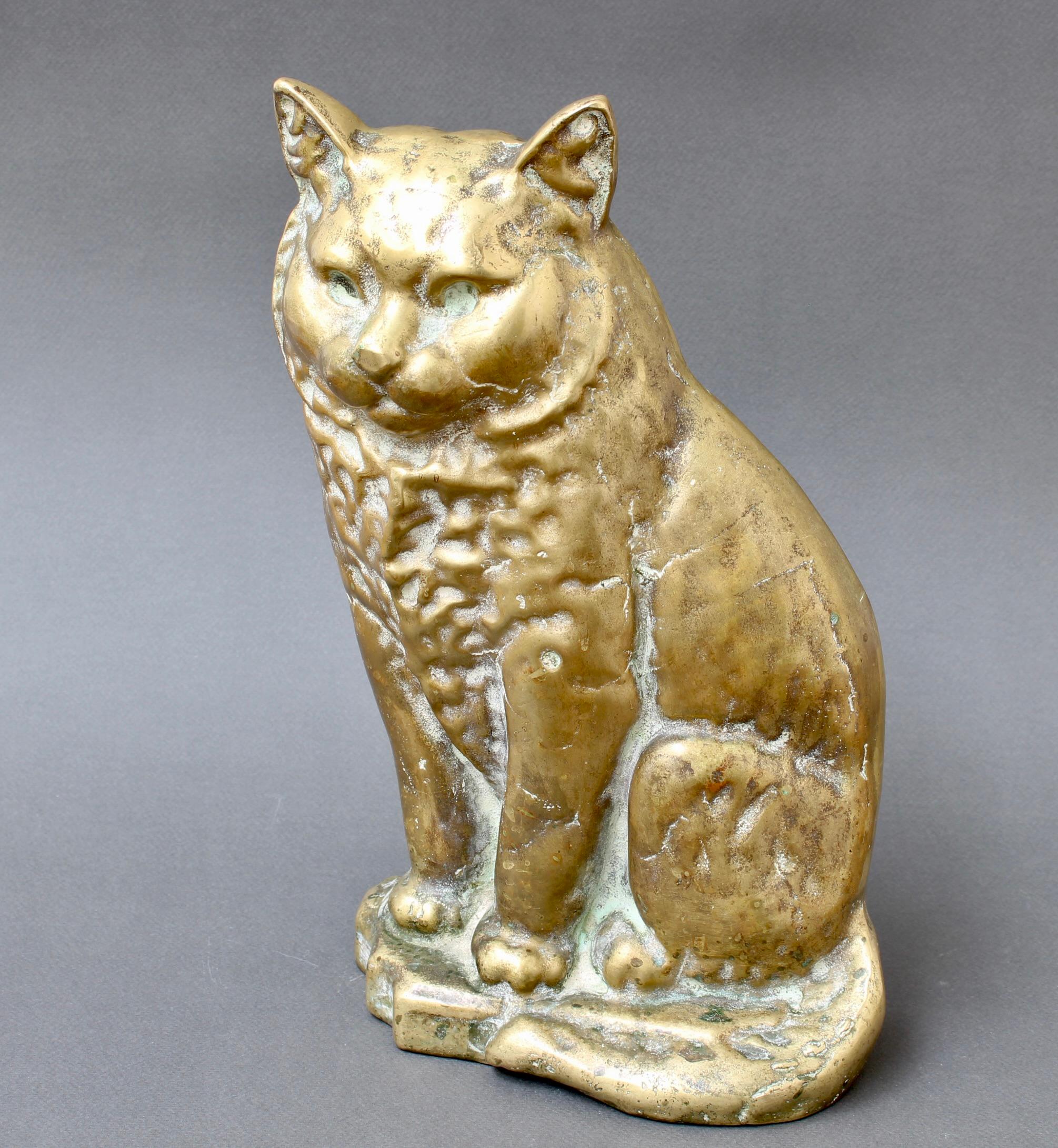 Antique figural Italian cast bronze cat (circa 1920s). This Italian marvel, born in the heart of the 1920s, is not just a statue; it's a portal to a bygone era where craftsmanship and admiration for nature converged. The patina, like the passage of