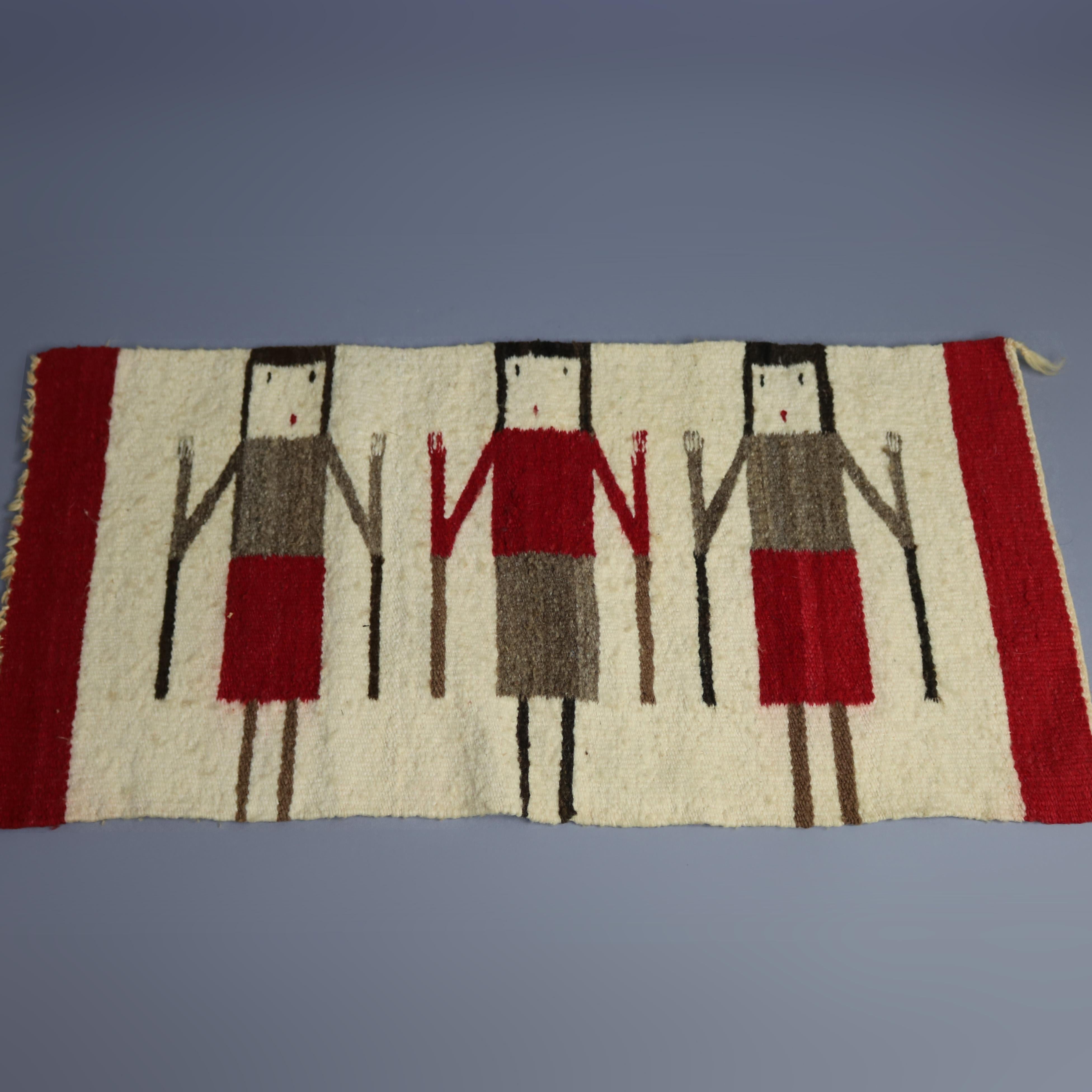 An antique figural Navajo Yei rug offers flat-weave wool construction with three female Yei with red vertical bordering, en verso display rod sleeve, circa 1930

Measures: 17.25