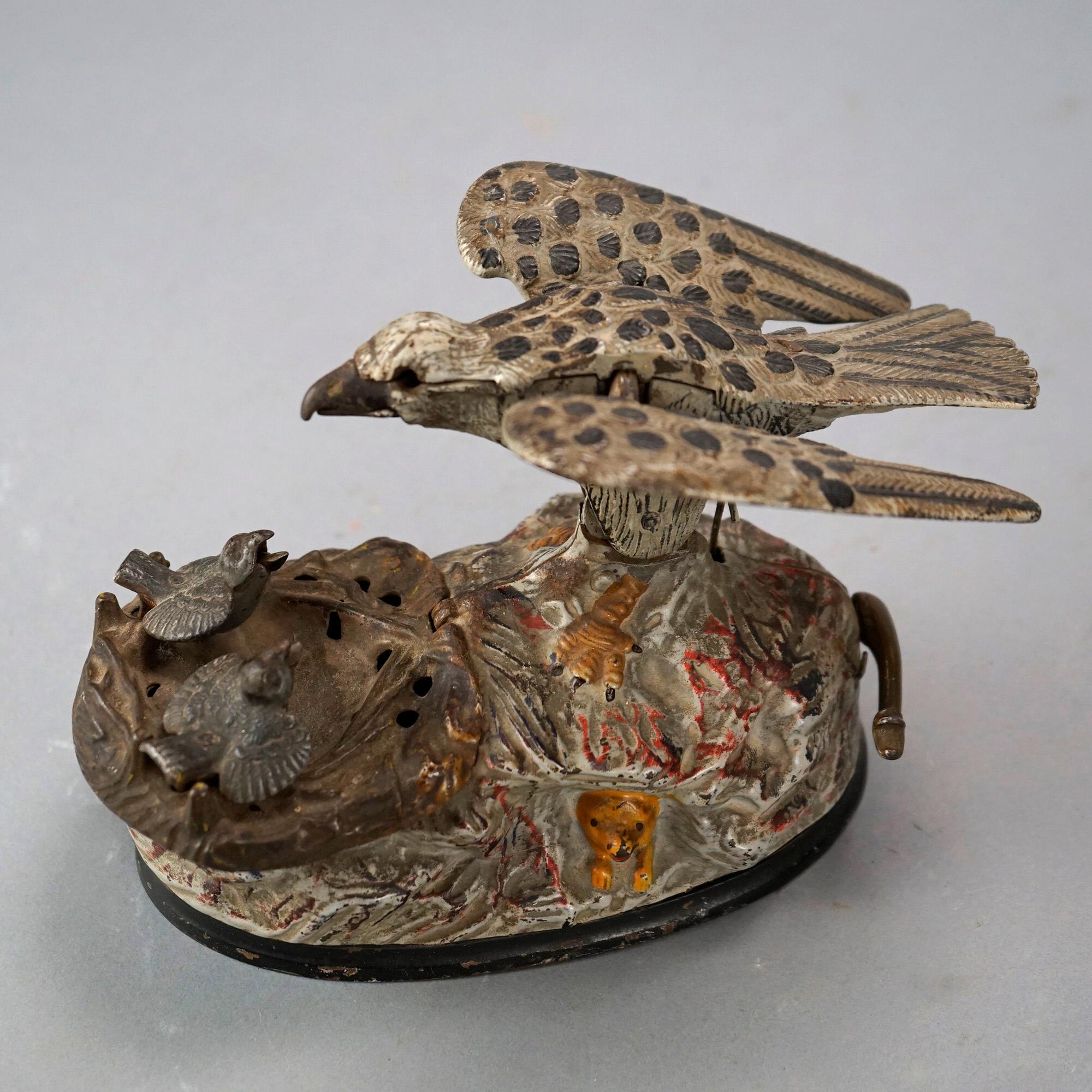 An antique figural bank offers polychromed cast iron construction with mother bird feeding her nest of baby chicks, identifying patent marks on base as photographed, c1890

Measures- 5.5''H x 4.75''W x 8.25''D