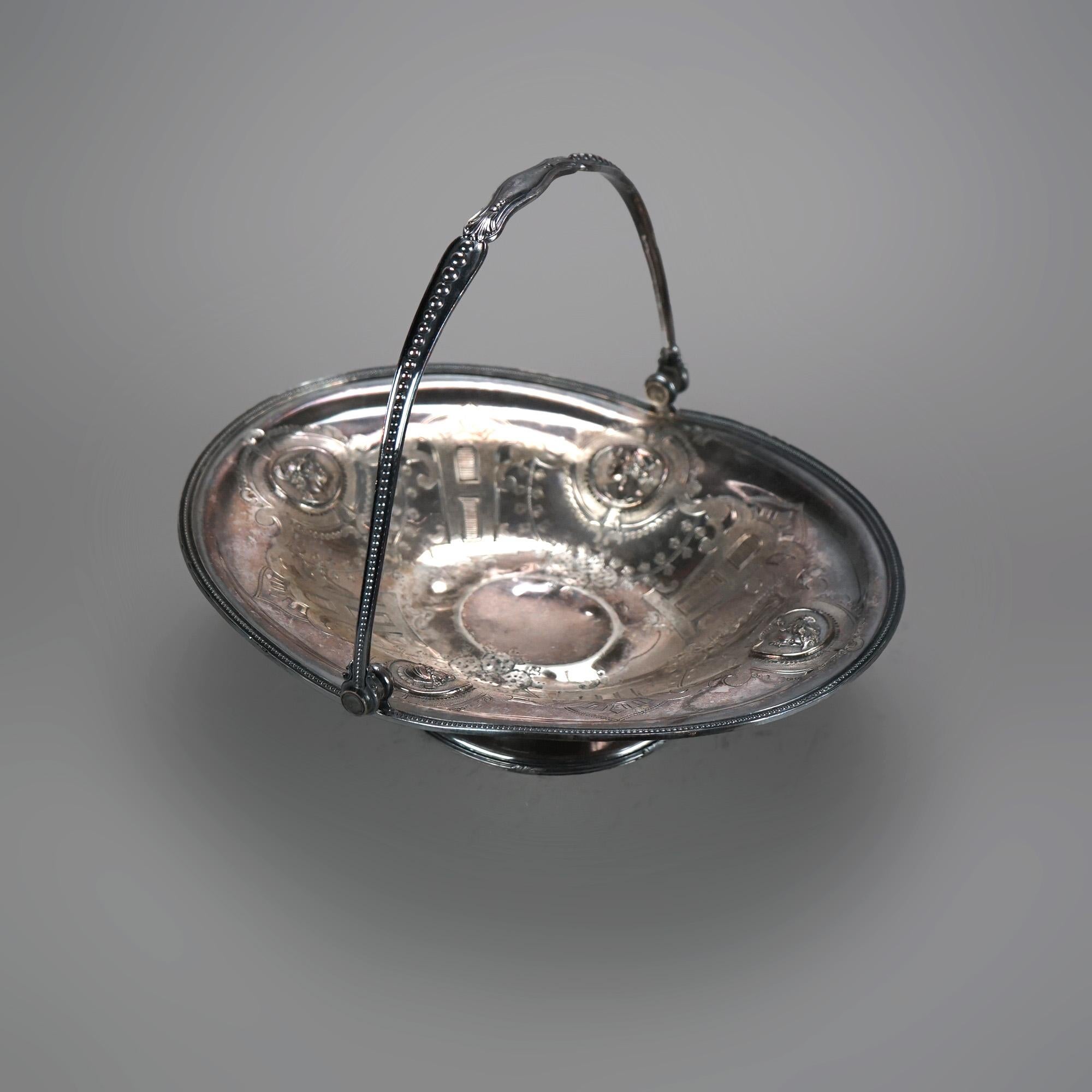 Antica Fruttiera figurata placcata in argento con incisione di maschere e foglie C1890

Misure: 9