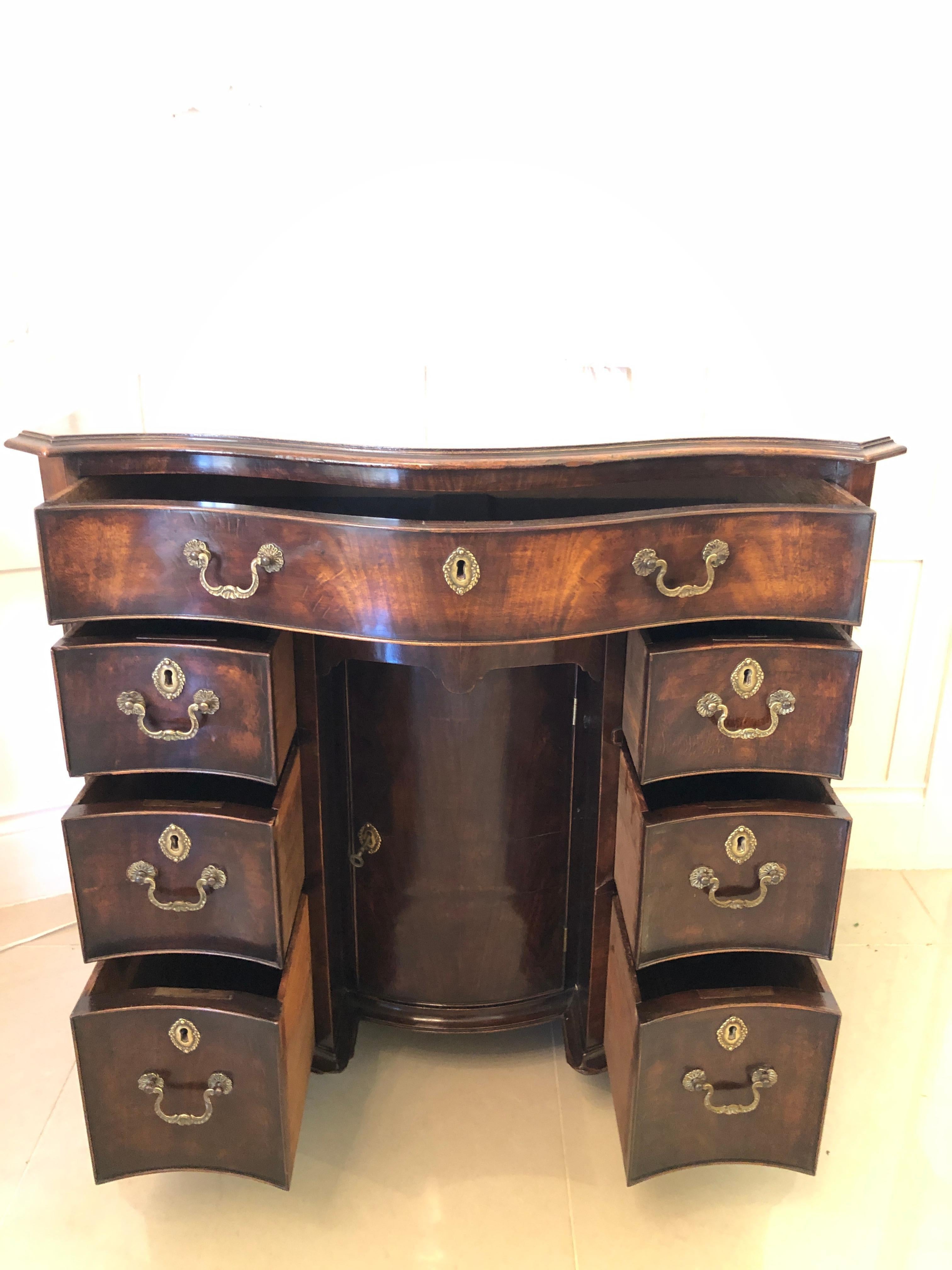 English  Antique Figured Mahogany Serpentine Shaped Knee Hole Desk For Sale