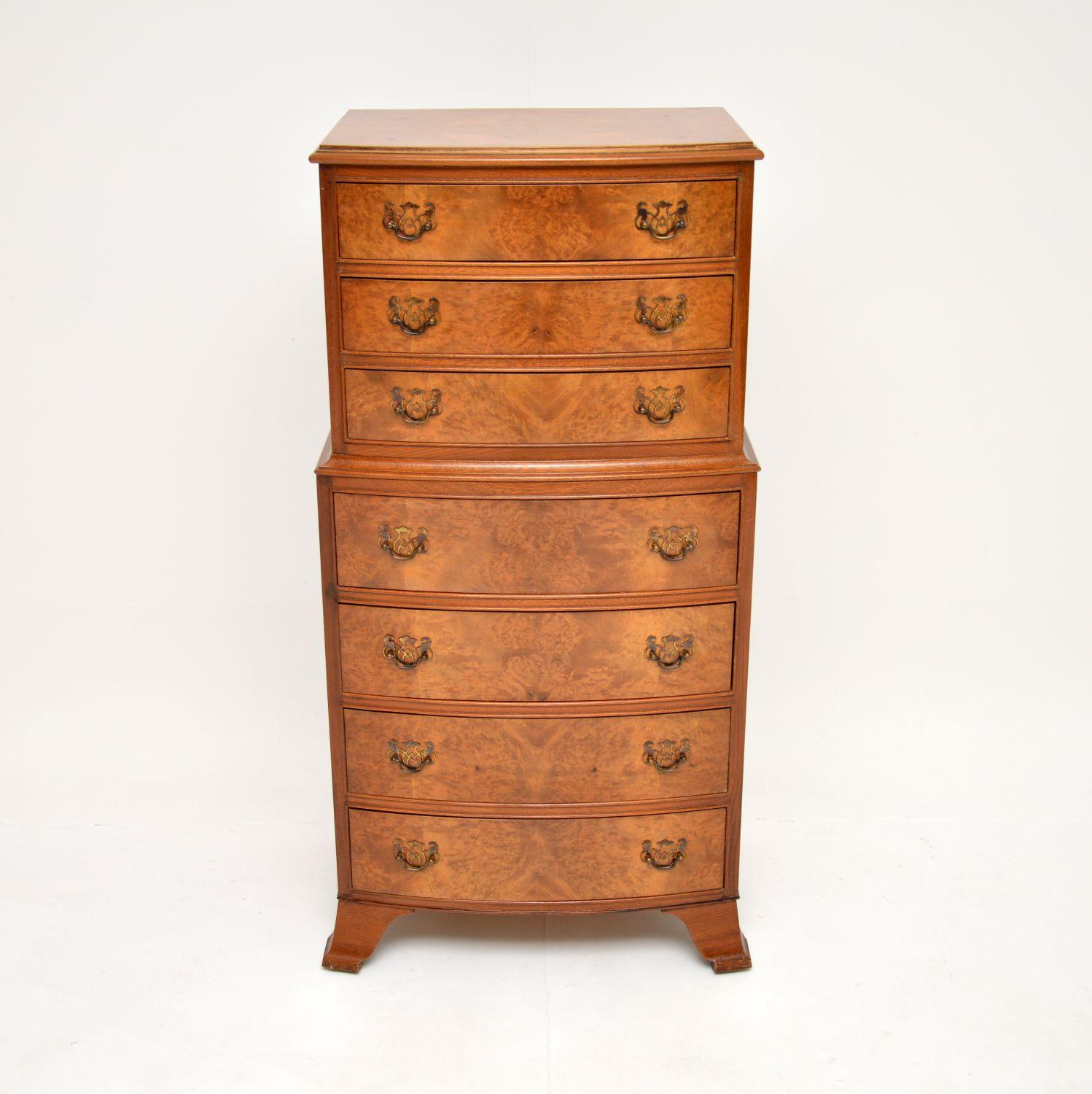 A gorgeous antique figured walnut chest on chest of drawers of small proportions in the Georgian style. This was made in England, it dates from around the 1930’s.

It is of great quality and is a very useful size; slim so as not to take up too much