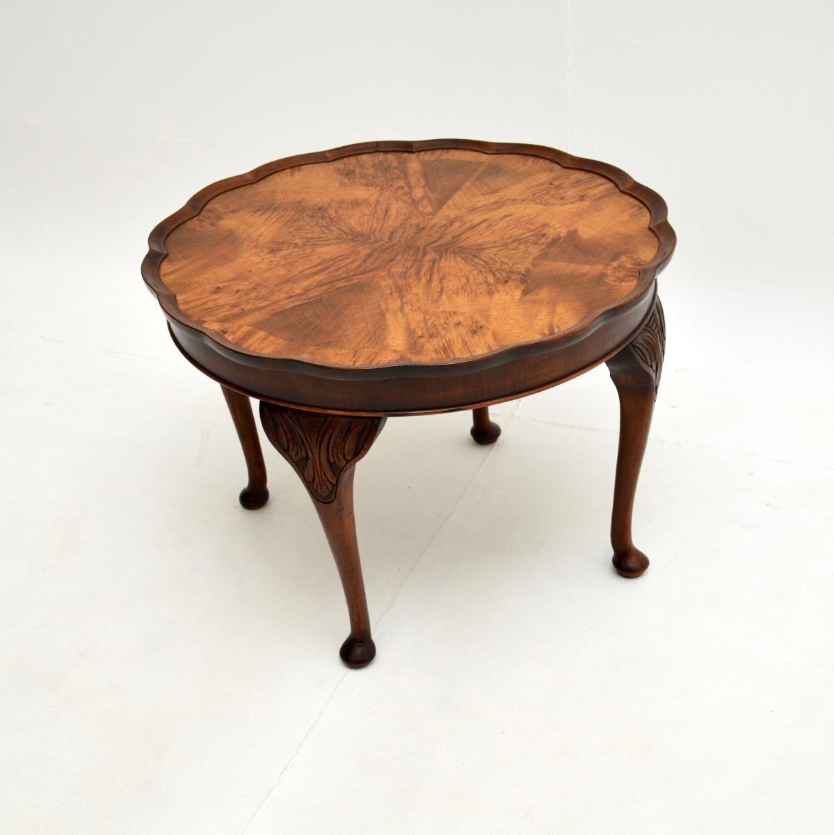 A lovely antique figured walnut pie crust coffee table. This was made in England, it dates from the 1920-30’s.

It is of very good quality and is a very useful size. The top has stunning figured walnut grain patterns, this sits on sturdy and shapely
