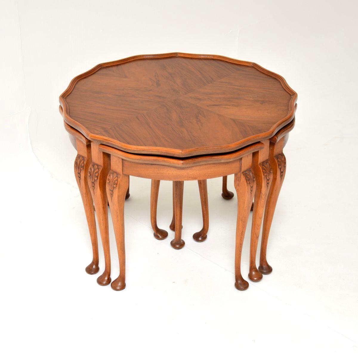 A beautiful and very useful antique figured walnut pie crust nesting coffee table. This was made in England, it dates from around the 1930’s period.

It is of superb quality, with a fine, elegant yet sturdy design. The larger circular coffee table