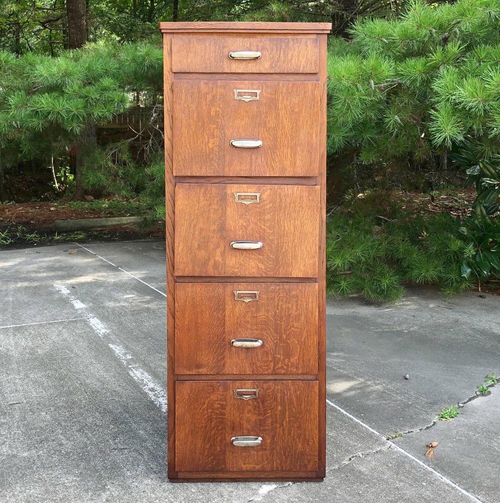 Antique file cabinet is perfect for organizing, and features oak construction and plenty of storage,
circa mid-1900s
Measures: 63 H x 22 W x 22 D.