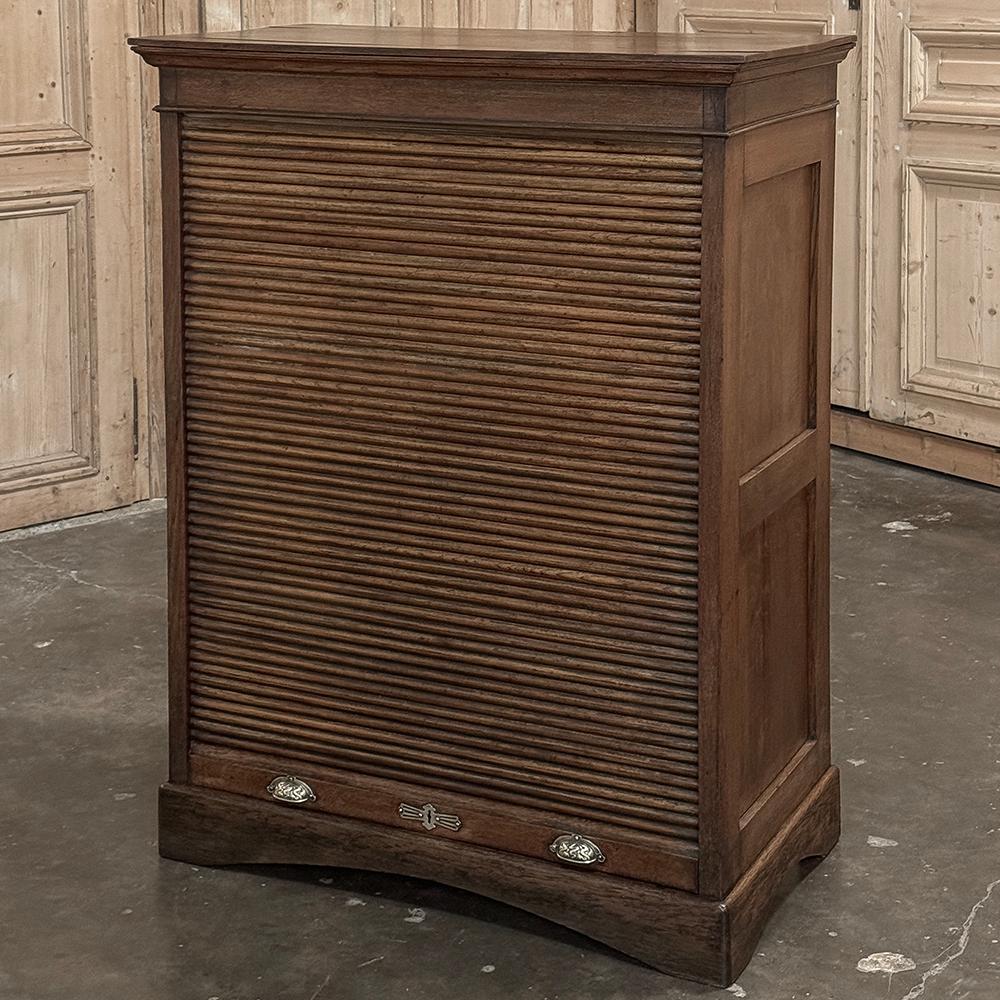 Antique File Card Cabinet with Tambour Door recalls the days prior to computers, when index cards held a wealth of information, used in just about every office, library, school and institution.  This clever cabinet was constructed entirely of oak,