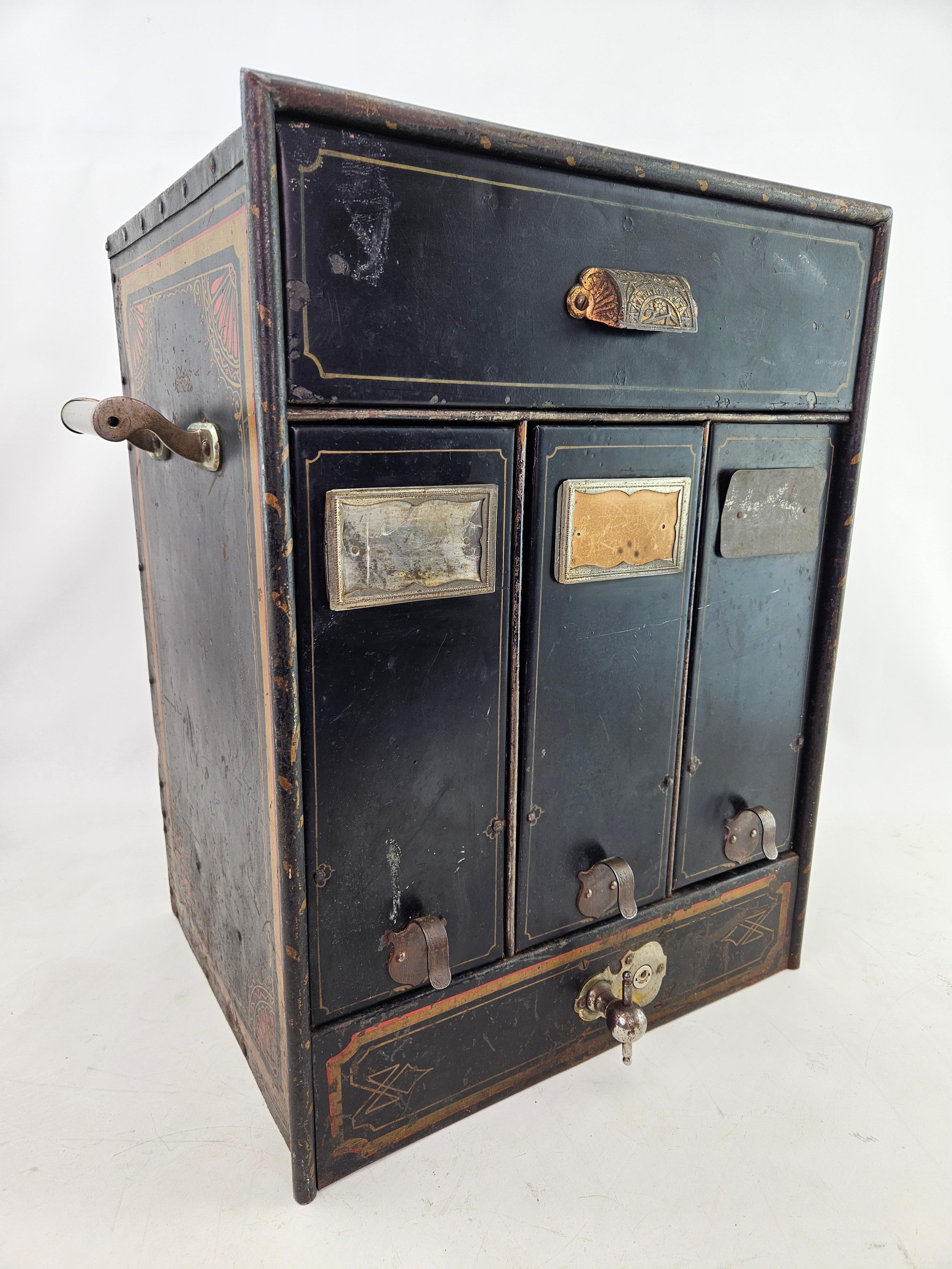 Antique File safe made in Rochester New York.  The locking mechanism works and keeps the top drawer and bottom three doors locked.  Unfortunately there is no key.  There is wear, dings and some corrosion due to age and use.  Please see the photos. 