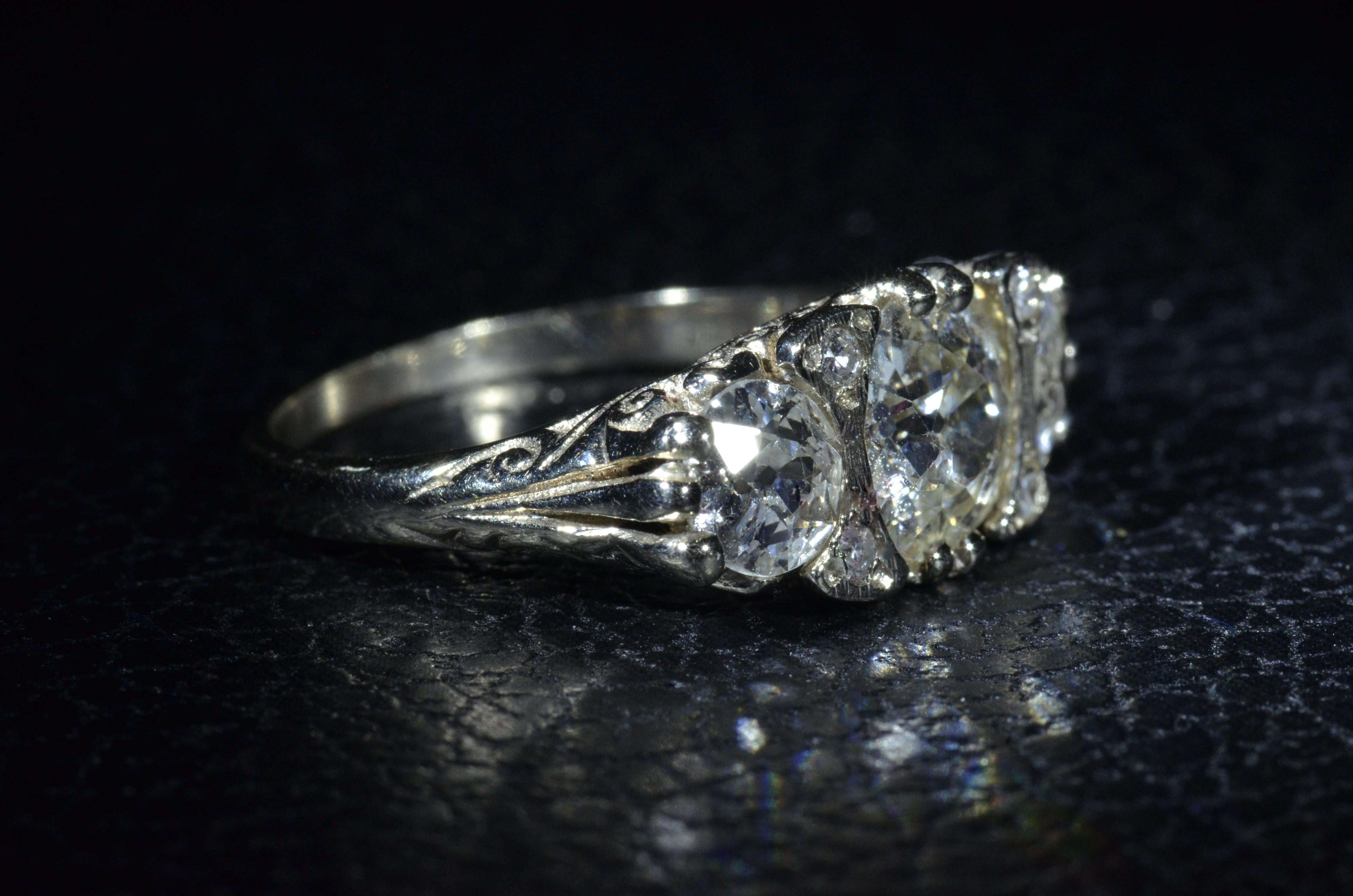 Old Mine Cut Antique Filigree ring set with a 1.53 Carat Diamond and 0.55 Carat Each Side For Sale