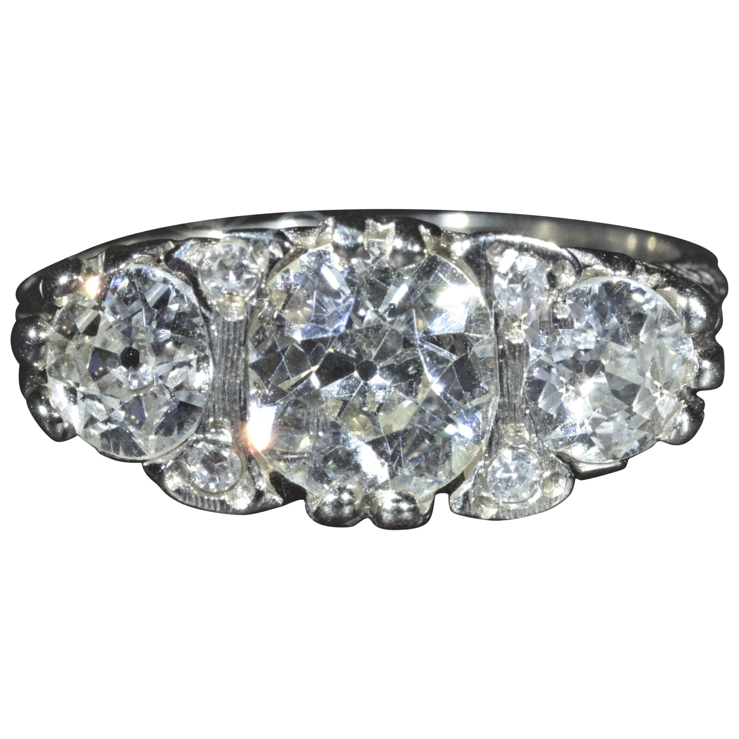 Antique Filigree ring set with a 1.53 Carat Diamond and 0.55 Carat Each Side For Sale