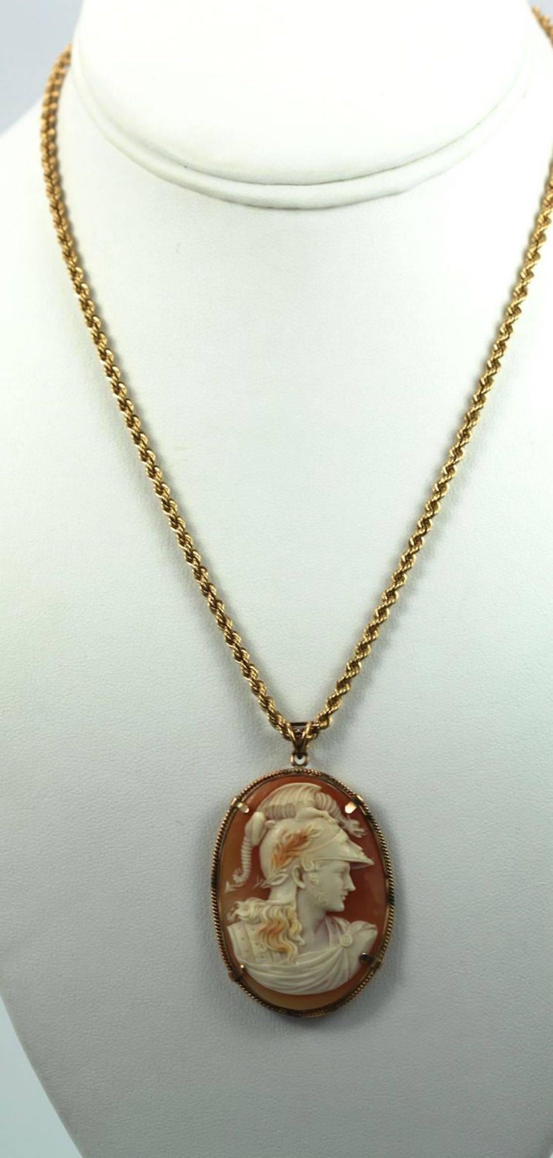 This Cameo depicts Ares- God of War.  It is extremely fine and see though as all fine cameo's should be.  This pendant Necklace is on a thick braided 18K gold chain. marked Italy. Take a close look at the Cameo, it has a face shield that is