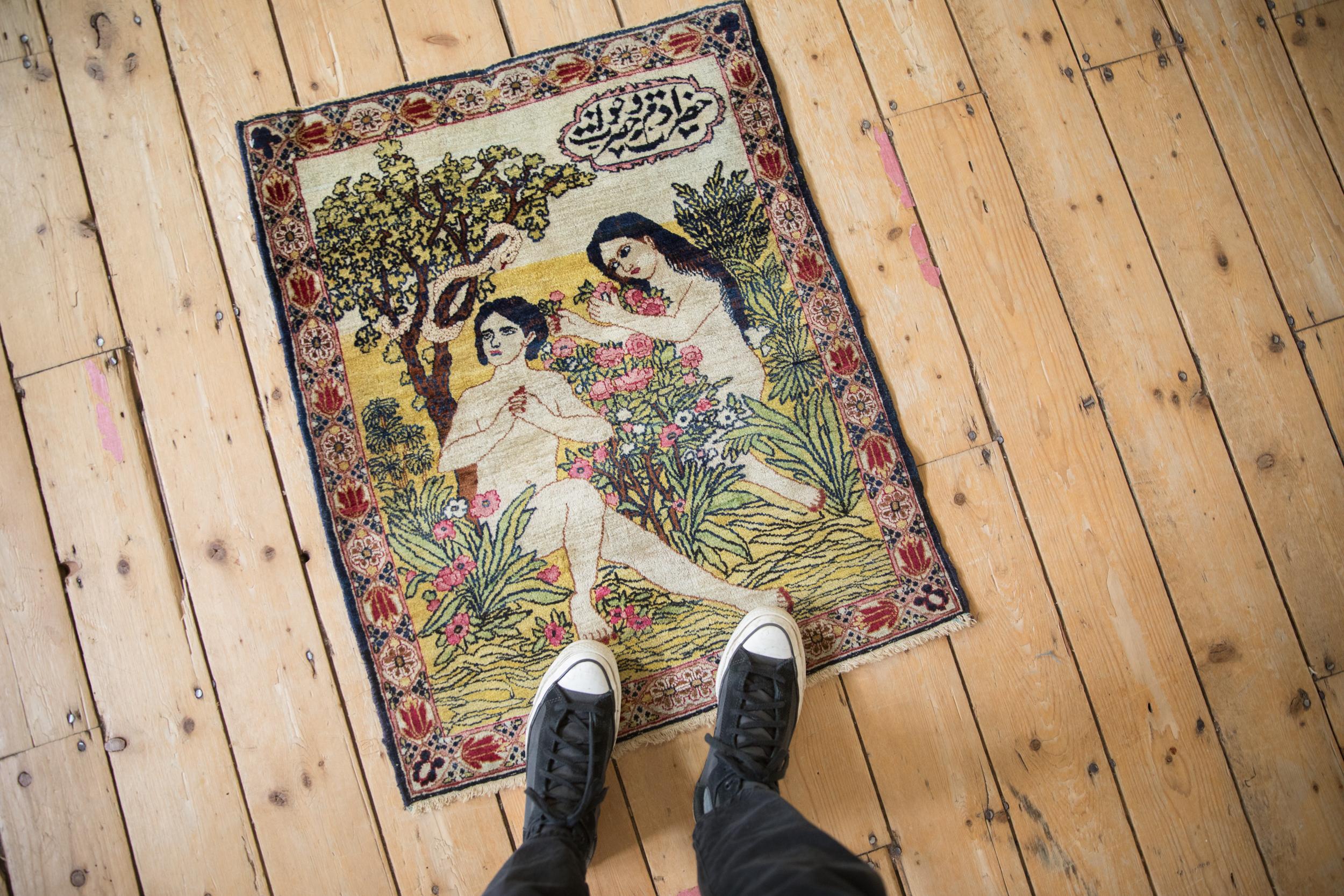 :: Incredibly fine and elaborate intricately detailed pictorial rug illustrating Adam and Eve in the garden of Eden with the serpent intricately drawn slithering in the apple tree with foliage covering throughout and an inscription panel at the top