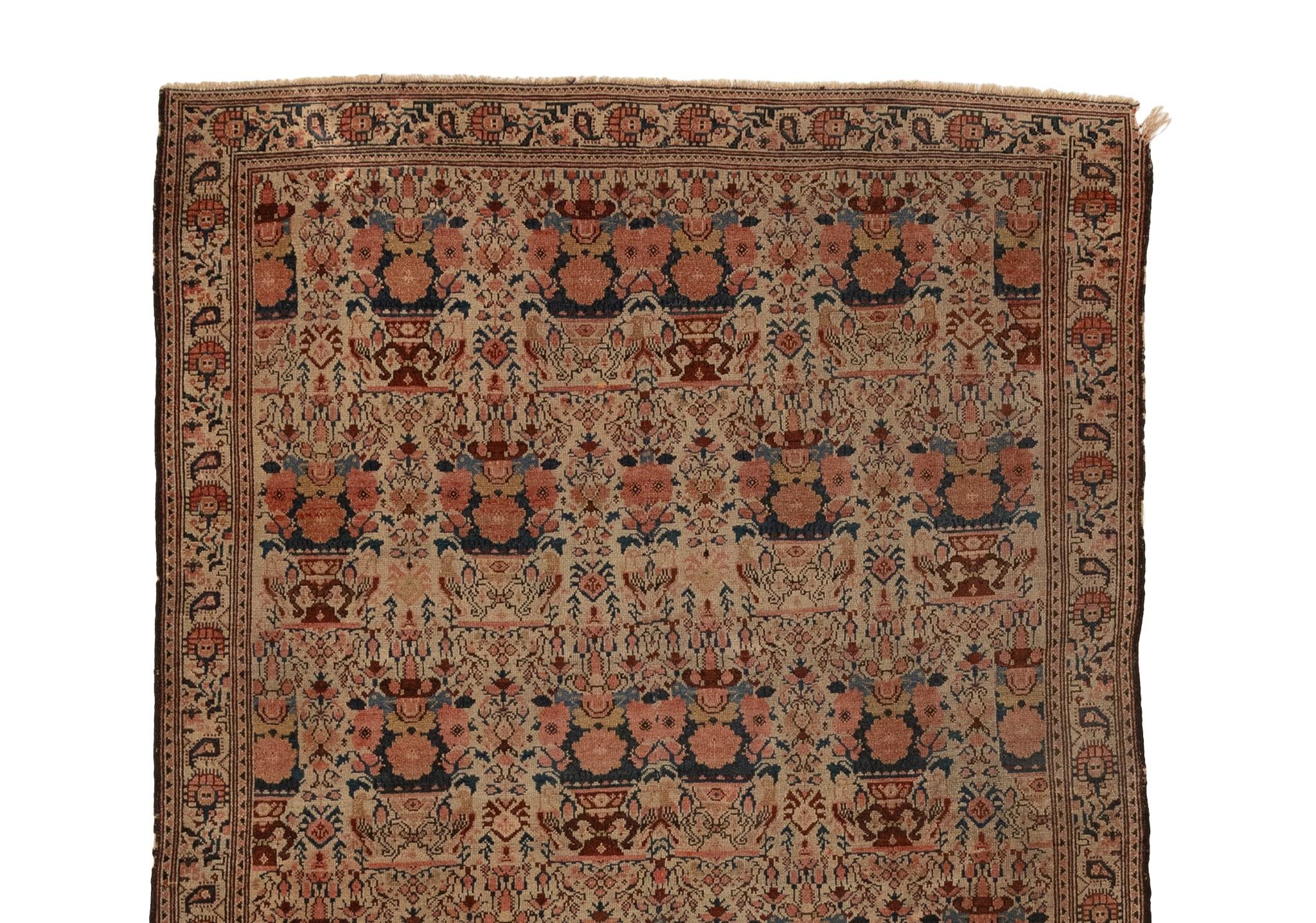 This antique Oriental rug from the 1880s boasts a mesmerizing floral design on an ivory field. Its timeless beauty radiates elegance and sophistication, elevating the aesthetic of any room it graces. This highly prized possession is only fully