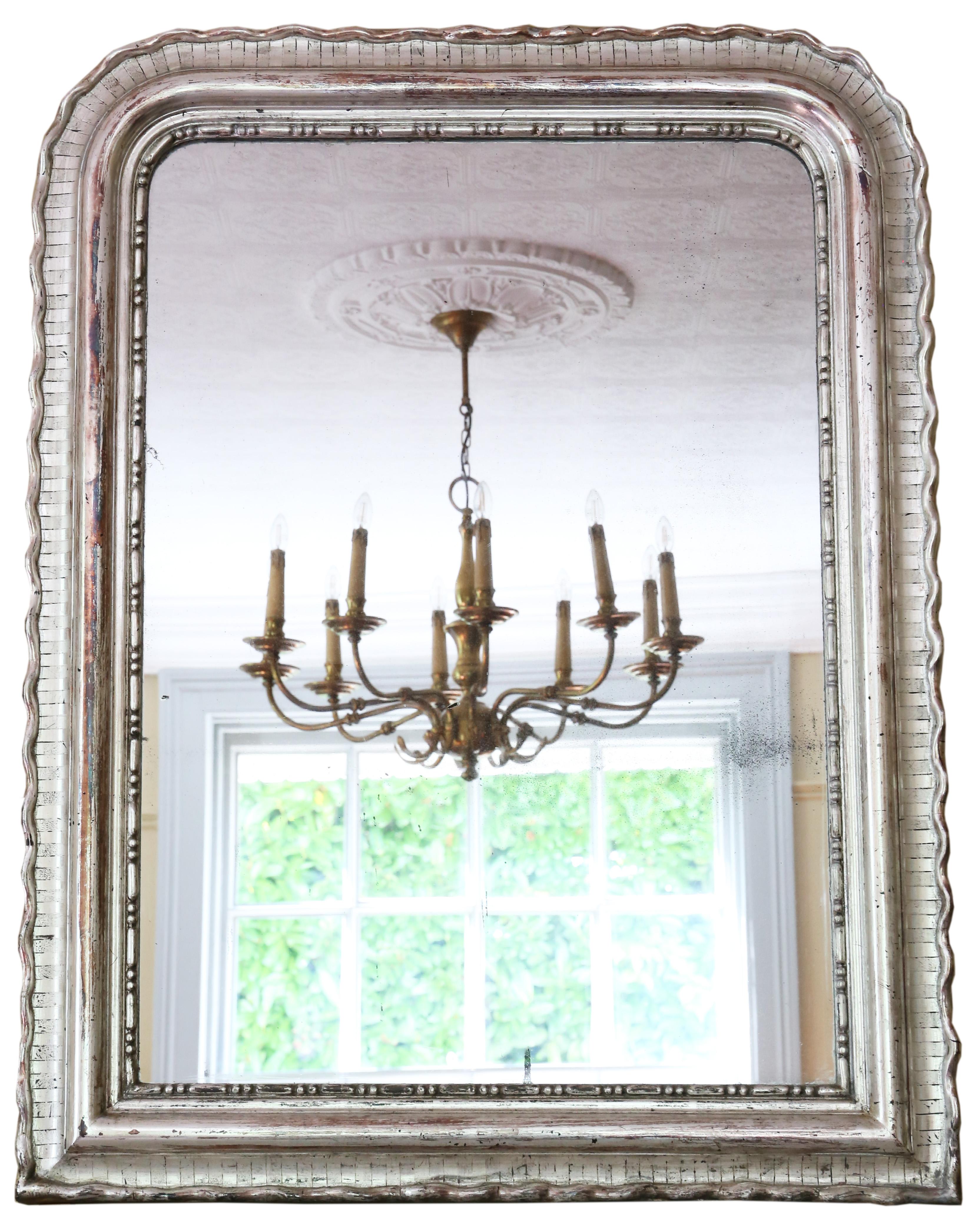 Antique fine quality large silver gilt 19th Century overmantle or wall mirror with a lovely charm and elegance.

This is a lovely, rare mirror and a great decorative find. Quality mirrors with silver gilding are so hard to find.

An impressive