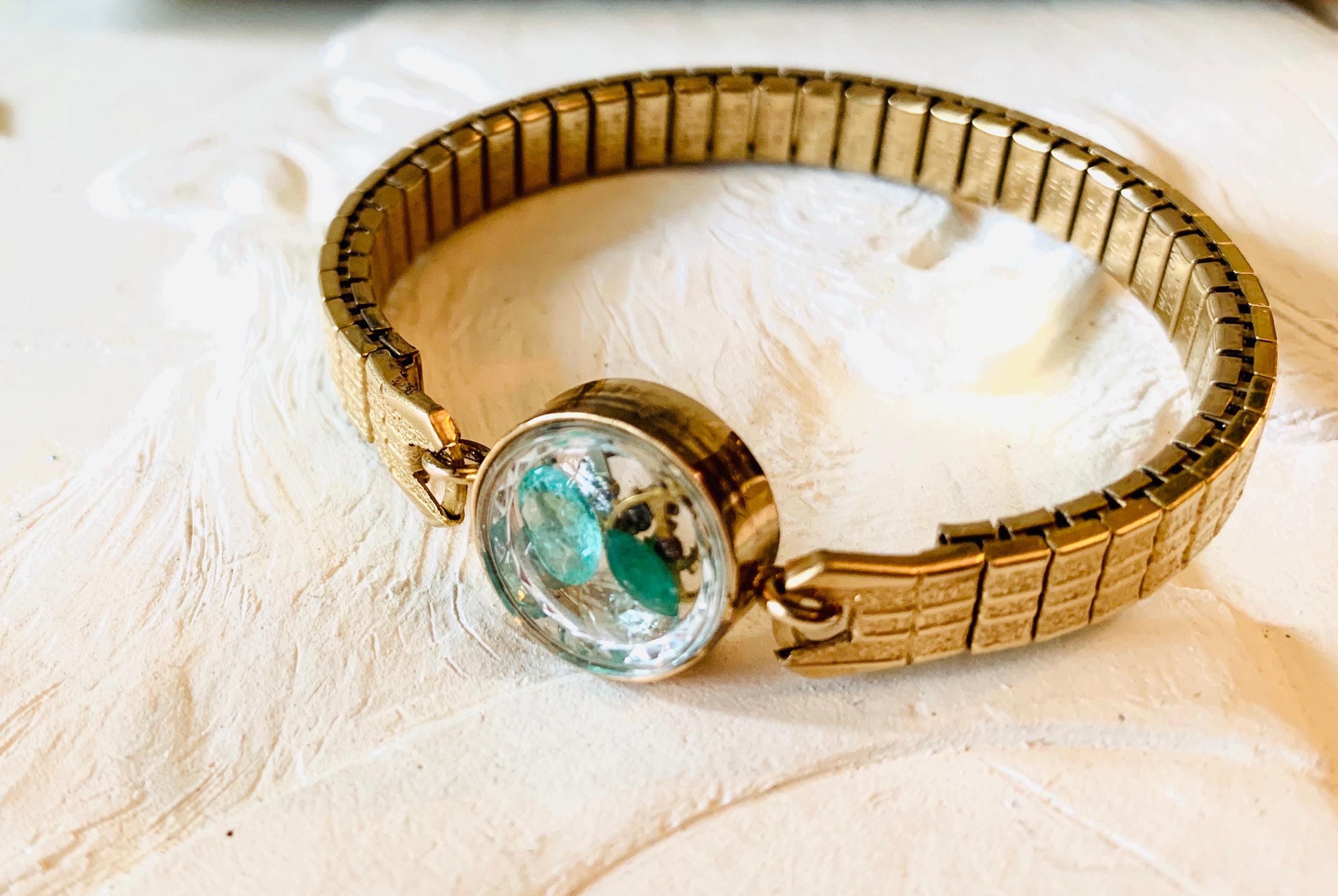 The Stardust band is a non-functioning antique watch  a symbol, a talisman,
to hold the intention of staying present, neither dwelling in
the past nor looking toward the future. The fairydust inside this particular band is 2 carats of Vintage