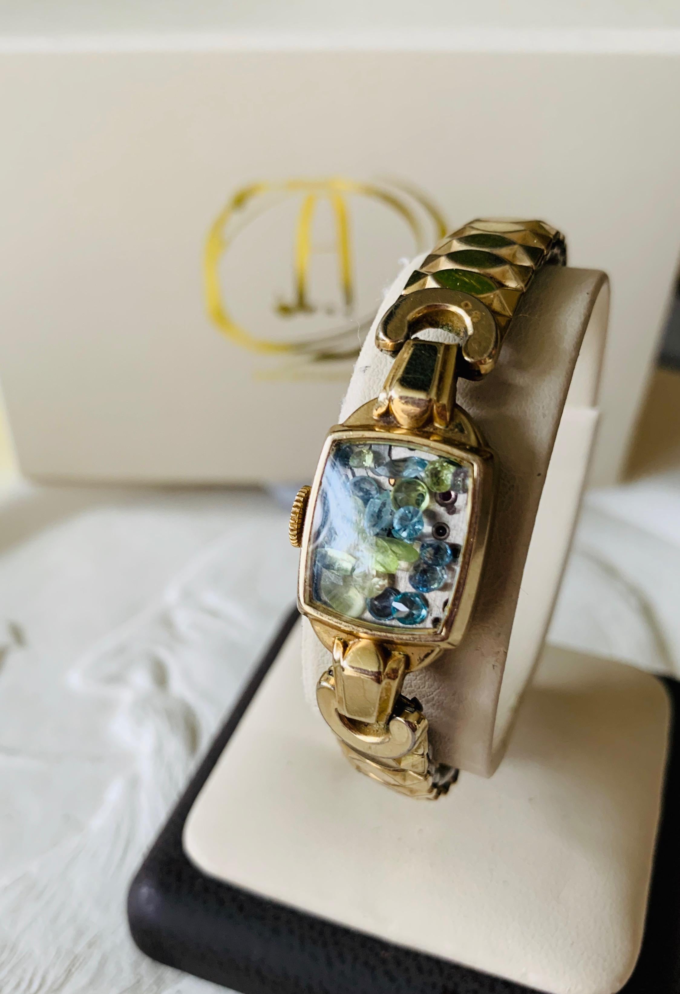 The Fairydust band is a non-functioning antique watch  a symbol, a talisman,
to hold the intention of staying present, neither dwelling in
the past nor looking toward the future. The fairydust inside this particular band is over 2 carats of Vintage