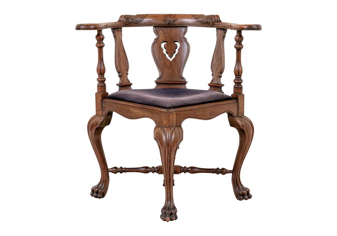 With finely carved details. The curved crest rail with center leaf motif and scrolled acanthus leaves on the sides, ending in scrolled arm ends. The shaped splat with openwork leaf motif, shaped supports and turned arms. The shaped seat rail raised
