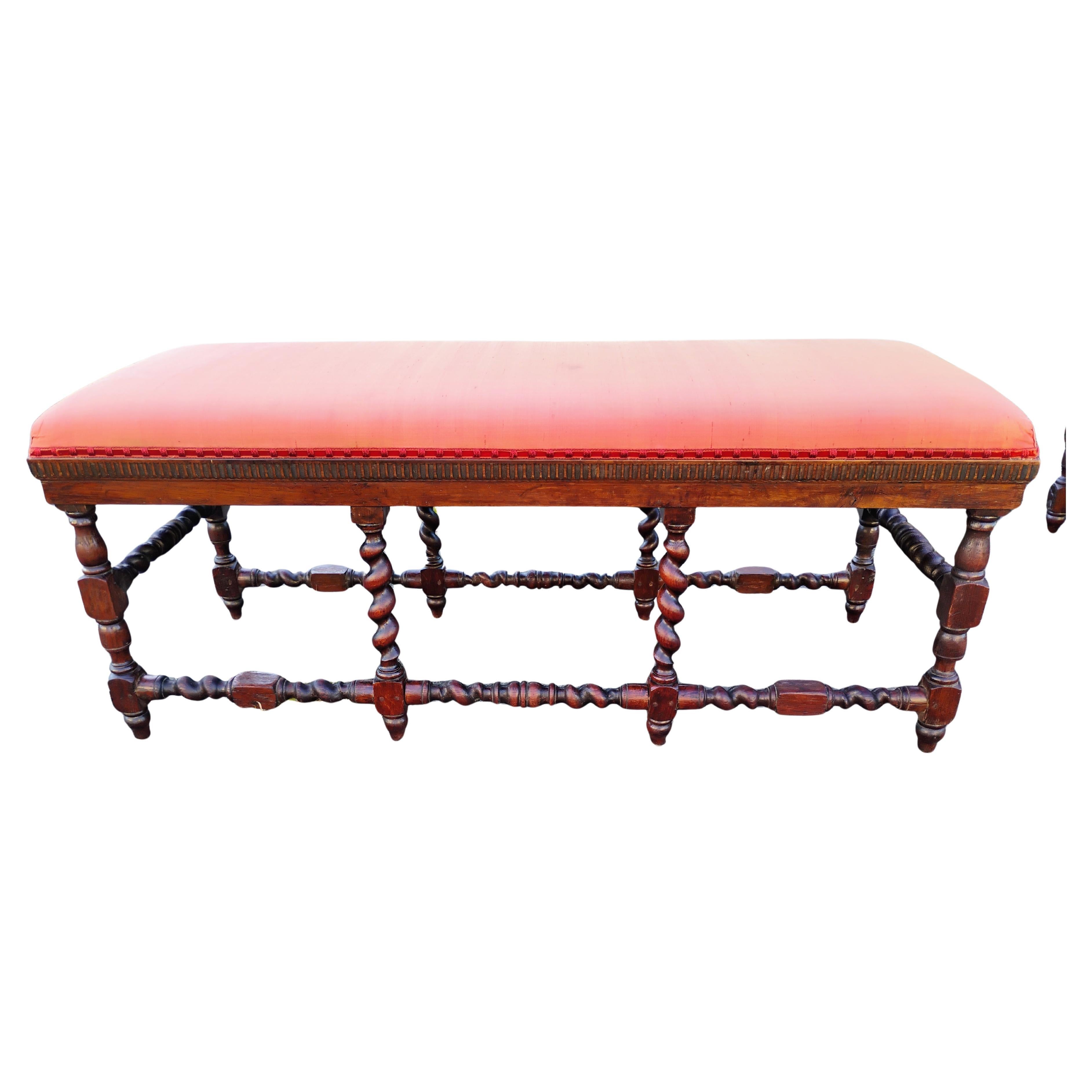 This is a fine pair of Jacobean period antique Barley Twist Benches.
They were made in France circa 1730-1750..
They're constructed of solid oak and are hand turned.
The benches are put together using wood pegs.
The holes on the underside are an