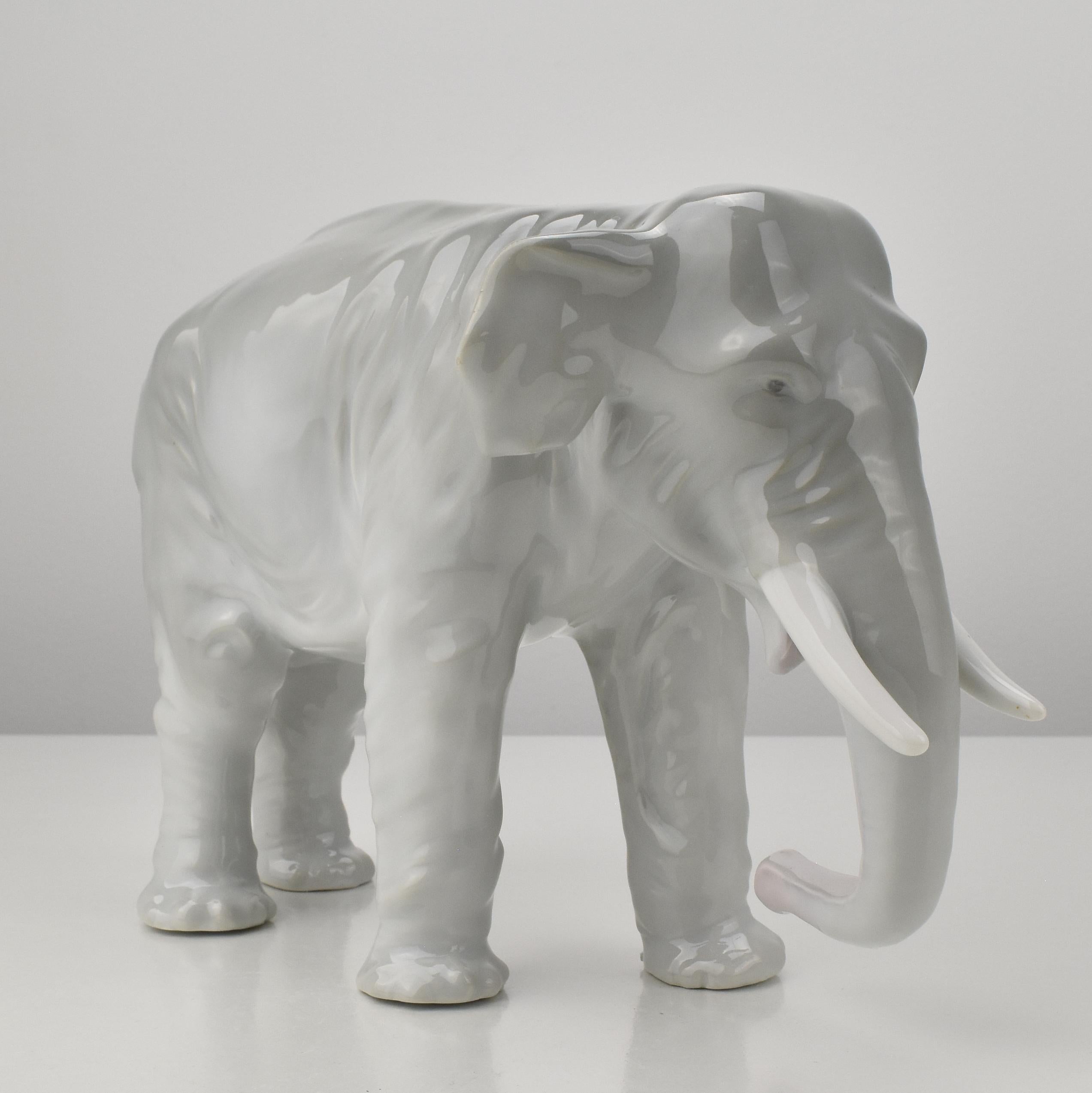 A naturalistic shaped and fine detailed elephant figurine from the Art Nouve era dating to around 1910.
The elephant is marked with a green unidetified manufacturer's mark.