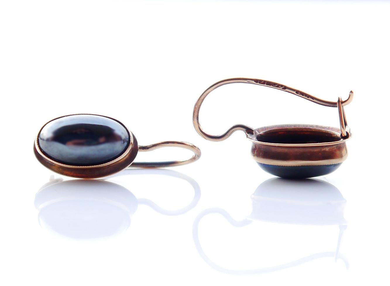 Vintage or Antique pair with cabochon-shaped Hematite stones, in solid 14K Rose Gold.

Each earring is 18 mm long and suspended. Each stone is 10 mm x 5 mm wide/ca.2,5 ct.

 What makes Hematite stone so attractive to be used in Jewelry making ?