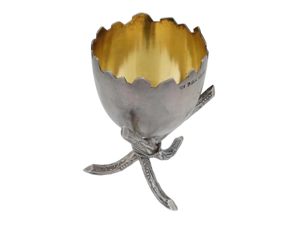An early 20th-century Finnish gilt silver footed egg stand. Broken egg shell design. Gilt interior. Figurative tripod foot. Makers mark TA, crown mark, 813H silver standard, P5 for the year 1920 are on the rim. Total Weight: 42.2 grams. Collectible
