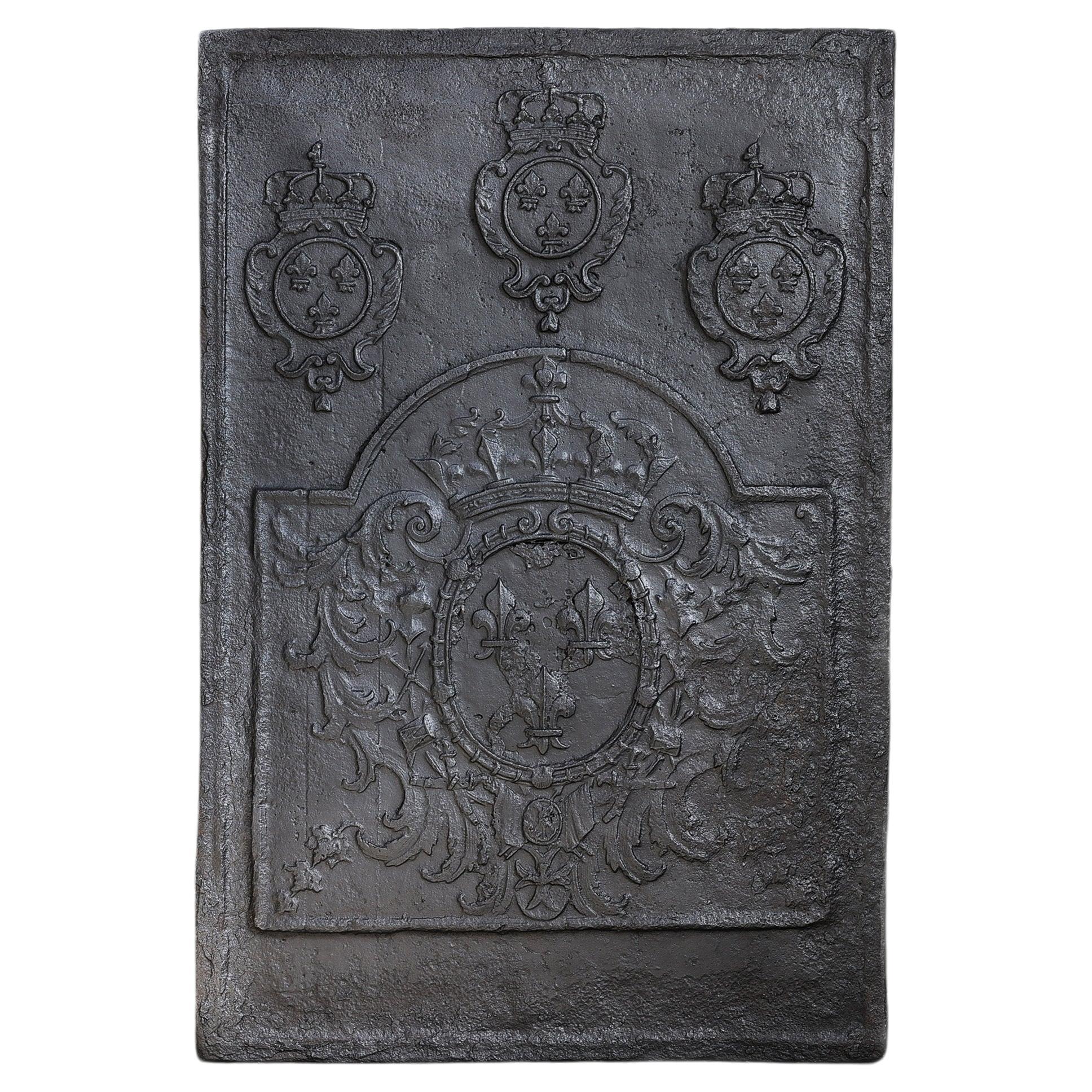 Plaque de cheminée ancienne en fonte du 18e siècle
