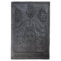 Plaque de cheminée ancienne en fonte du 18e siècle