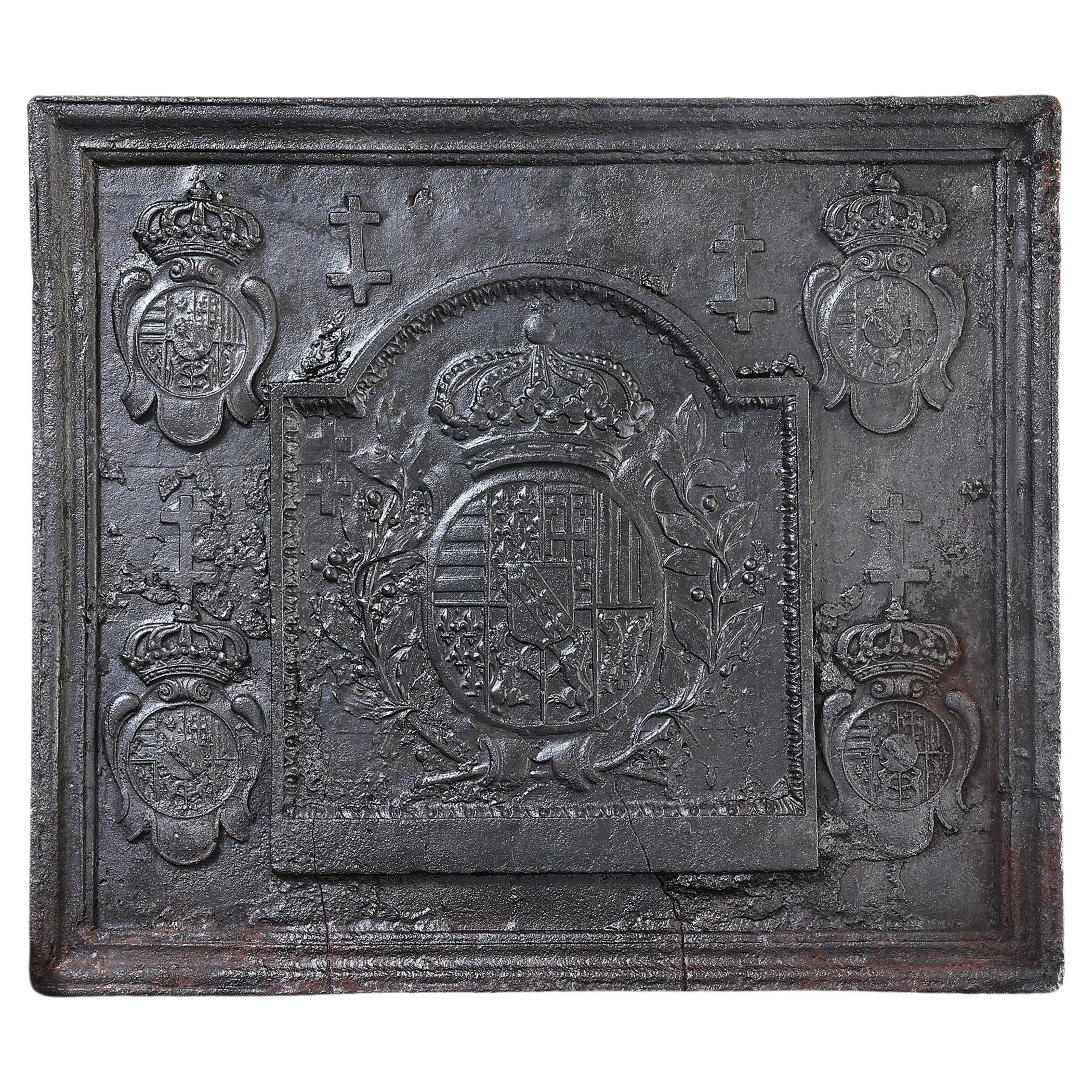 Antique fireback from cast iron from the early 18th century