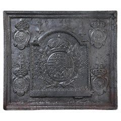 Antique fireback from cast iron from the early 18th century