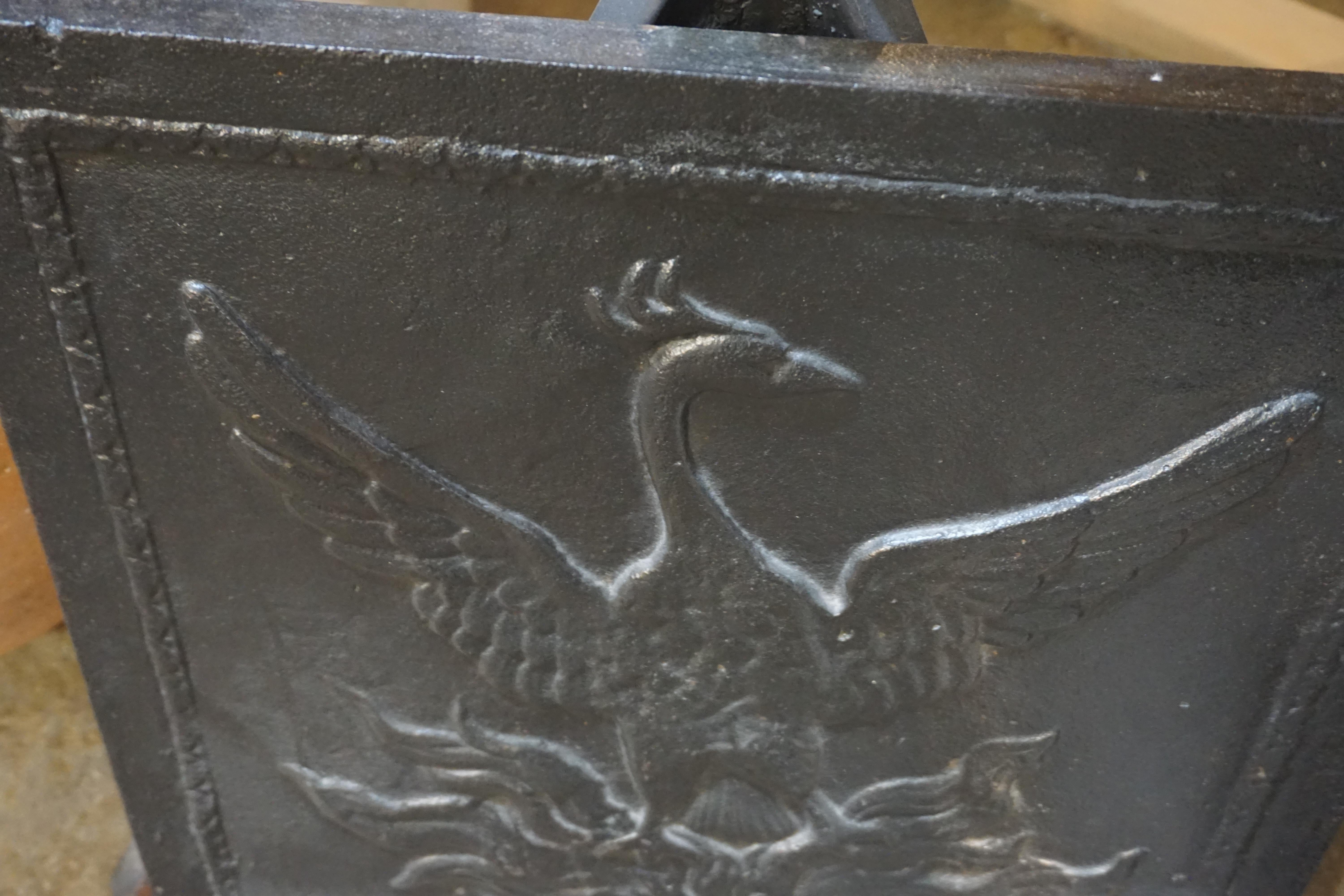 This antique fireback depicts a phoenix raising it's wings. Originates from France circa 

Measurements: 19.75