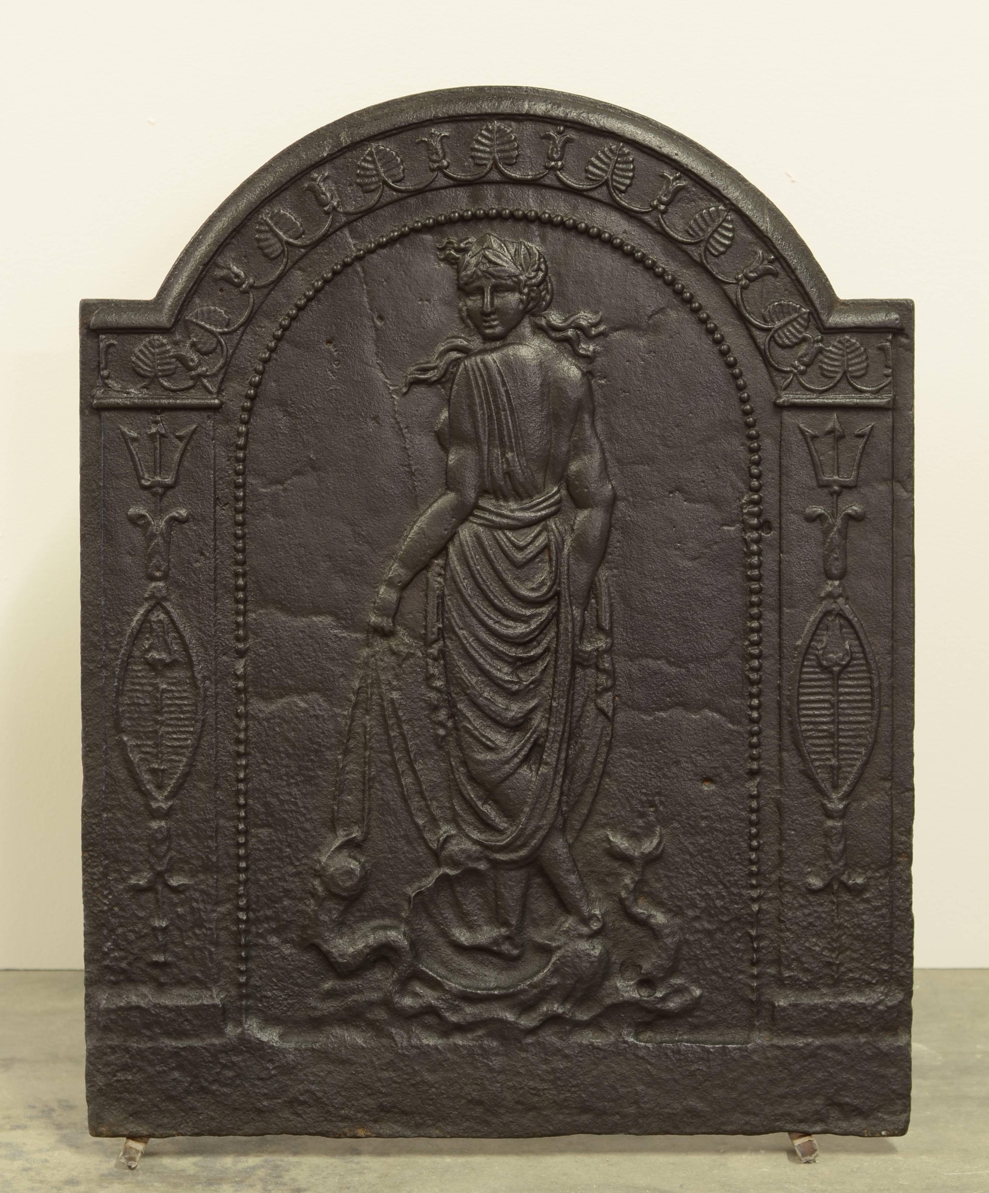 Beautifully detailed cast iron fireback showing Venus the Goddess of love, beauty and fertility.

This fireback is in great condition, to be used an a fireplace or as backsplash.
Can be supplied with stand.