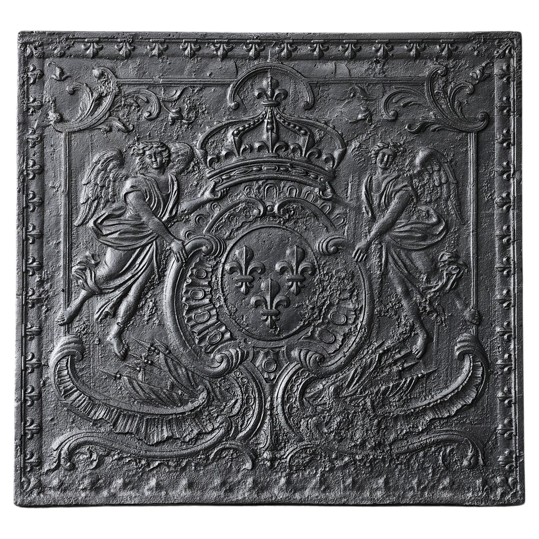 Antique fireback from cast iron from the early 19th century