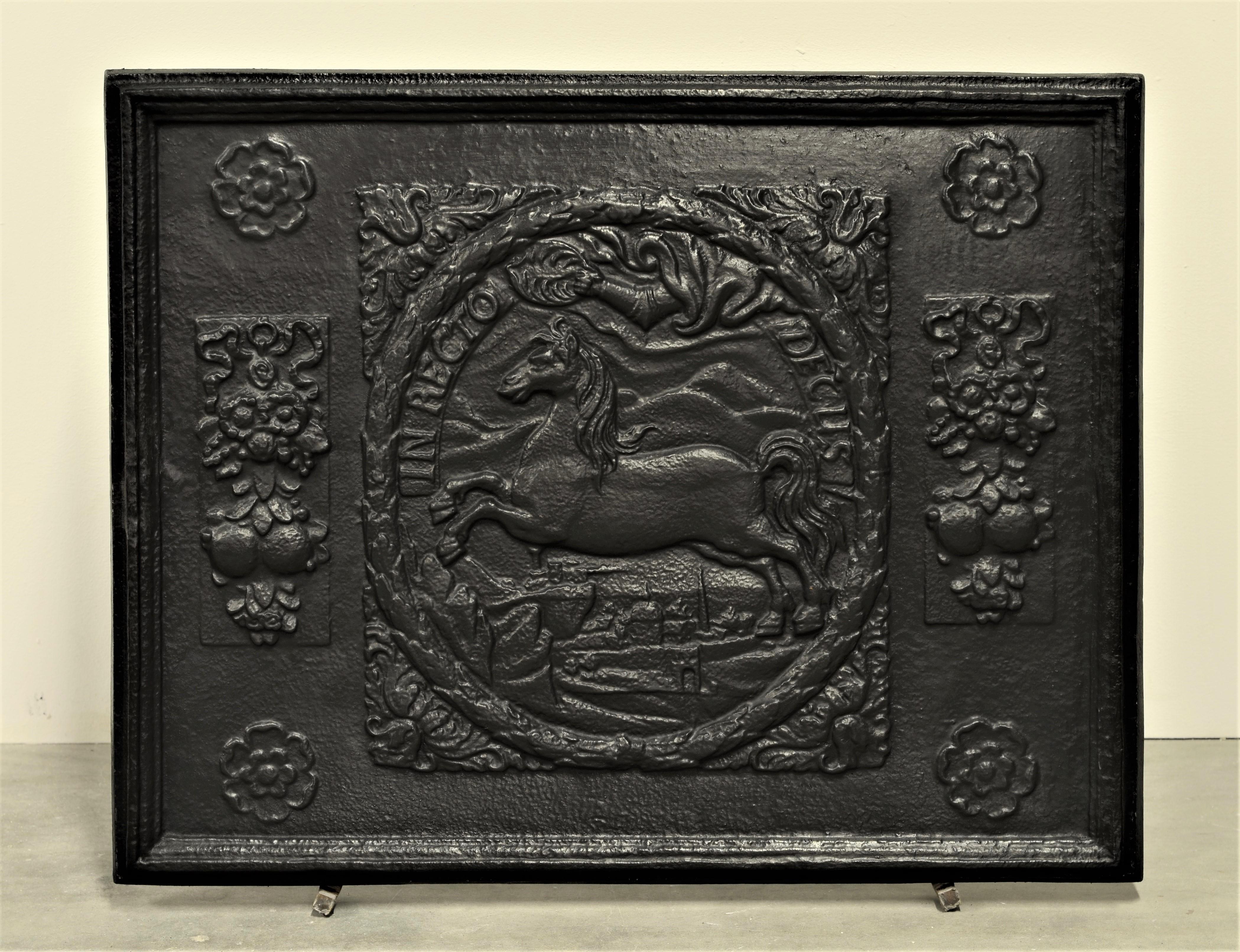 Very decorative fireback, showing several decorations, jumping horse and 