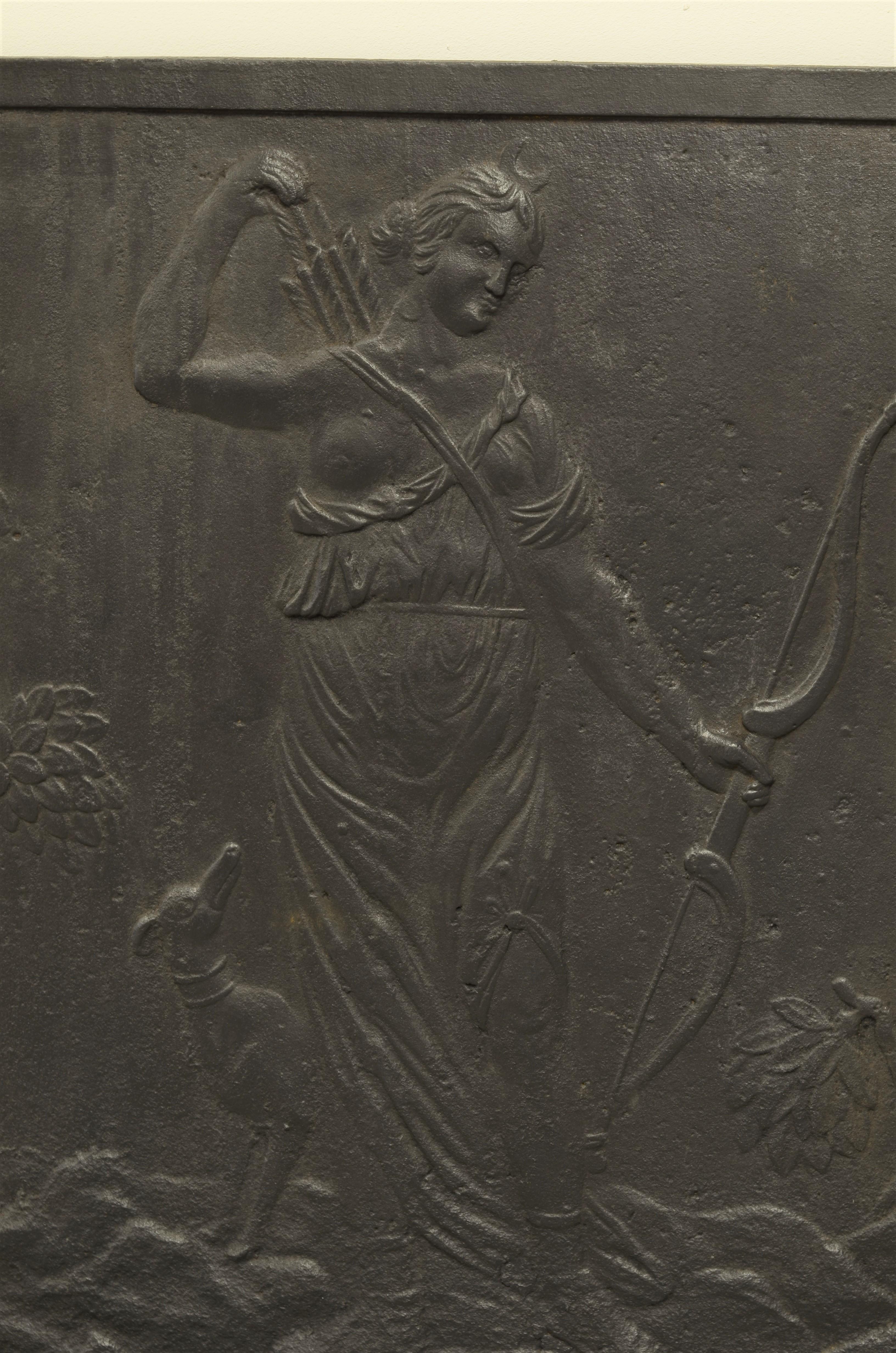 This beautiful and square antique cast- iron fireback shows the goddes Dianna.
She is a Roman goddess of the hunt, the Moon, and nature. 

Great condition, can be used in fire or as a impressive backsplash.

Sold by Schermerhorn Antique