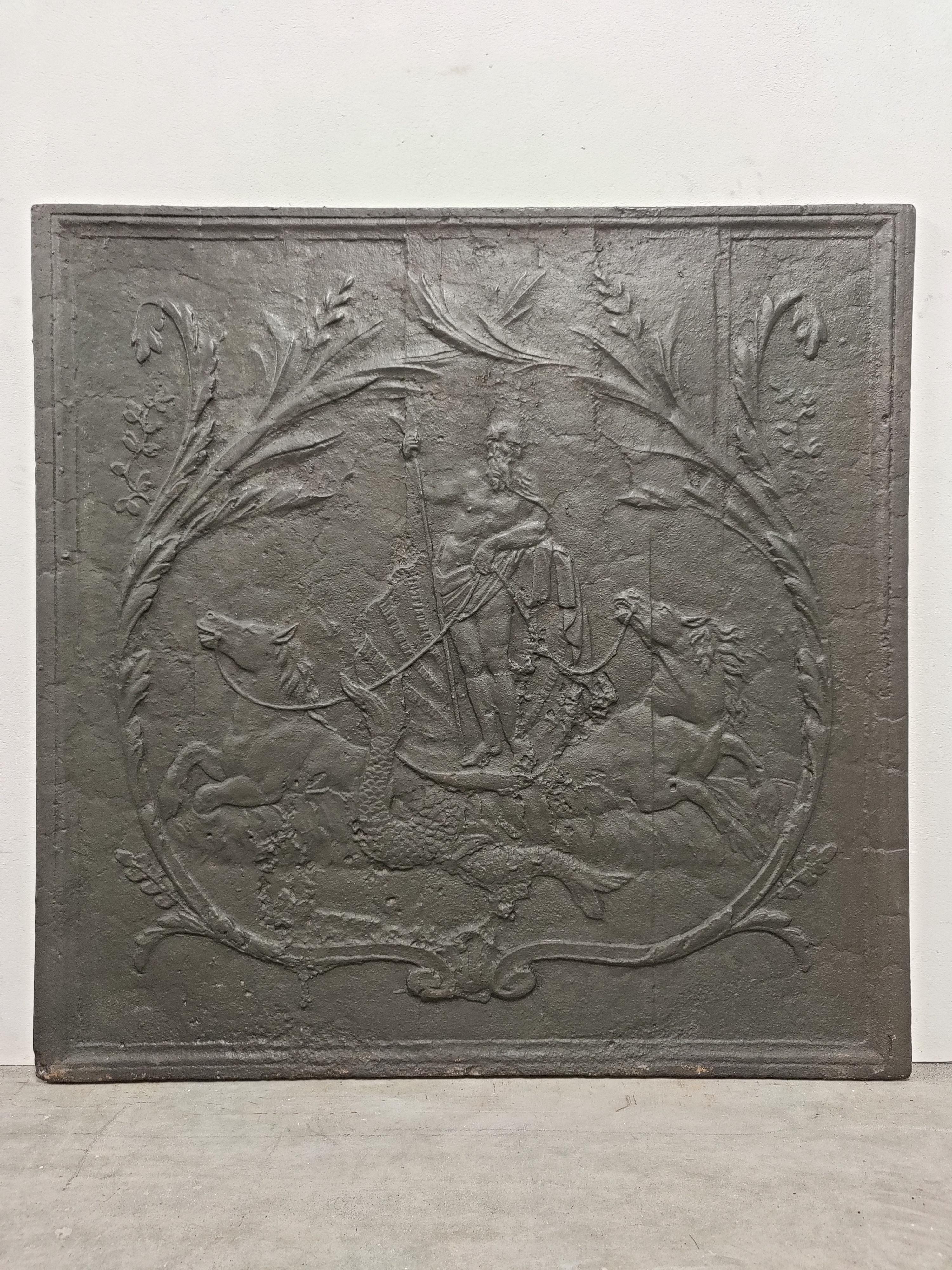 Beautifully detailed and square antique cast iron fireback.

This fireback shows Poseidon standing on a big shell in between of his sea horses while holding his trident.

Excellent condition, very usable dimension.
Can be placed in a fire or as