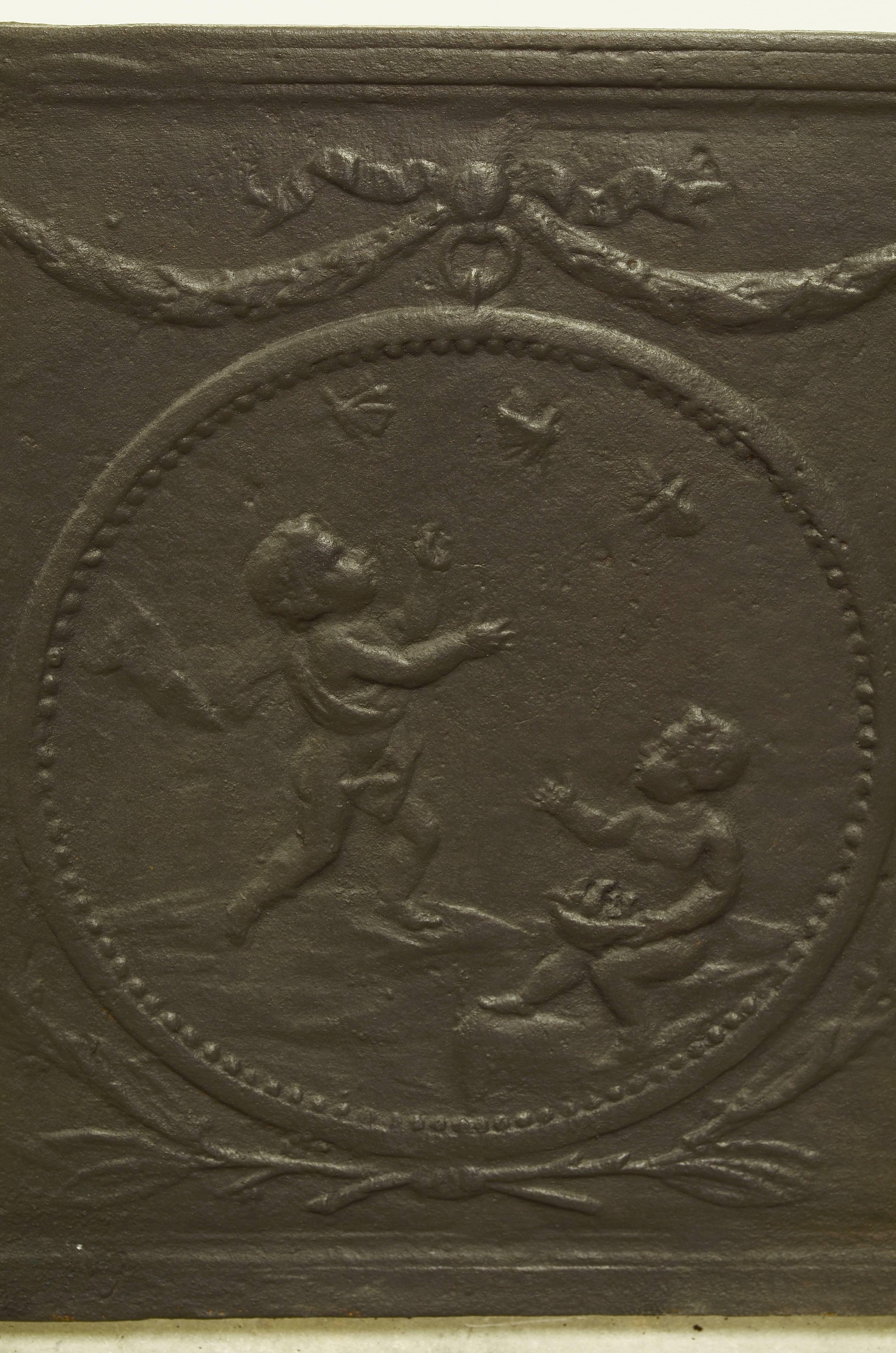 Louis XVI Antique Fireback with Two Cupids in a Circle For Sale