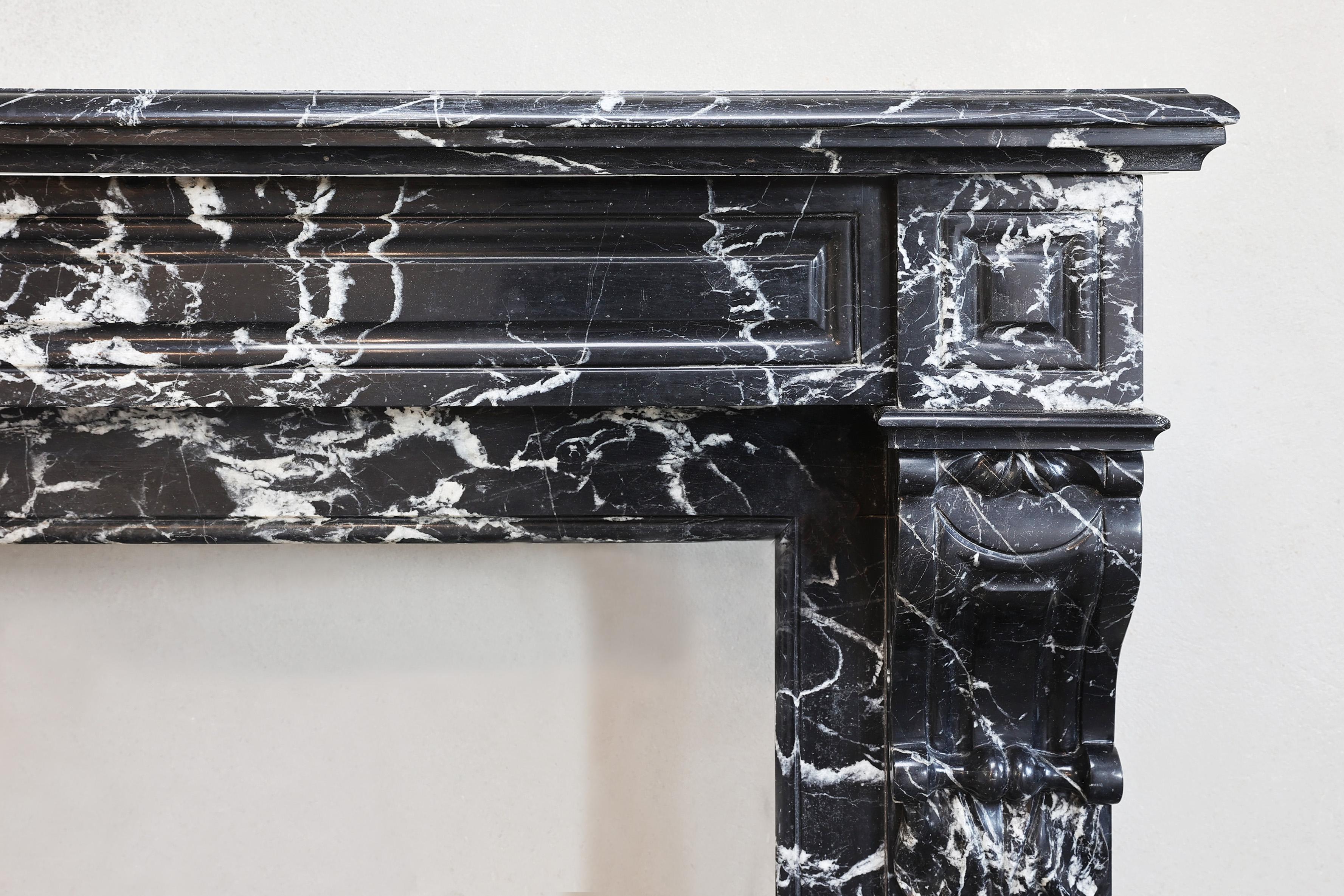 French antique fireplace from the 19th century in Nero Marquina marble style Louis XVI For Sale