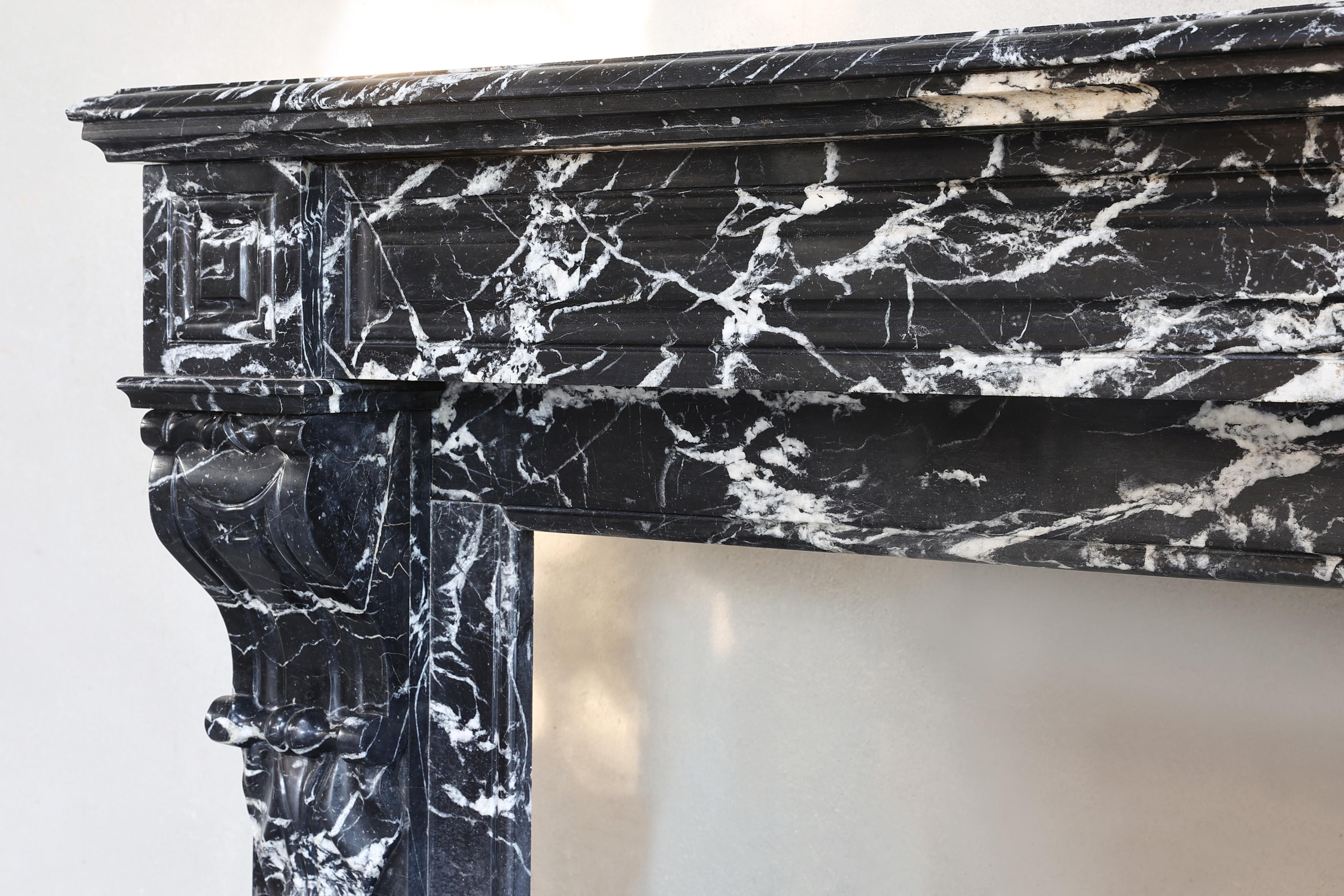 Marble antique fireplace from the 19th century in Nero Marquina marble style Louis XVI For Sale